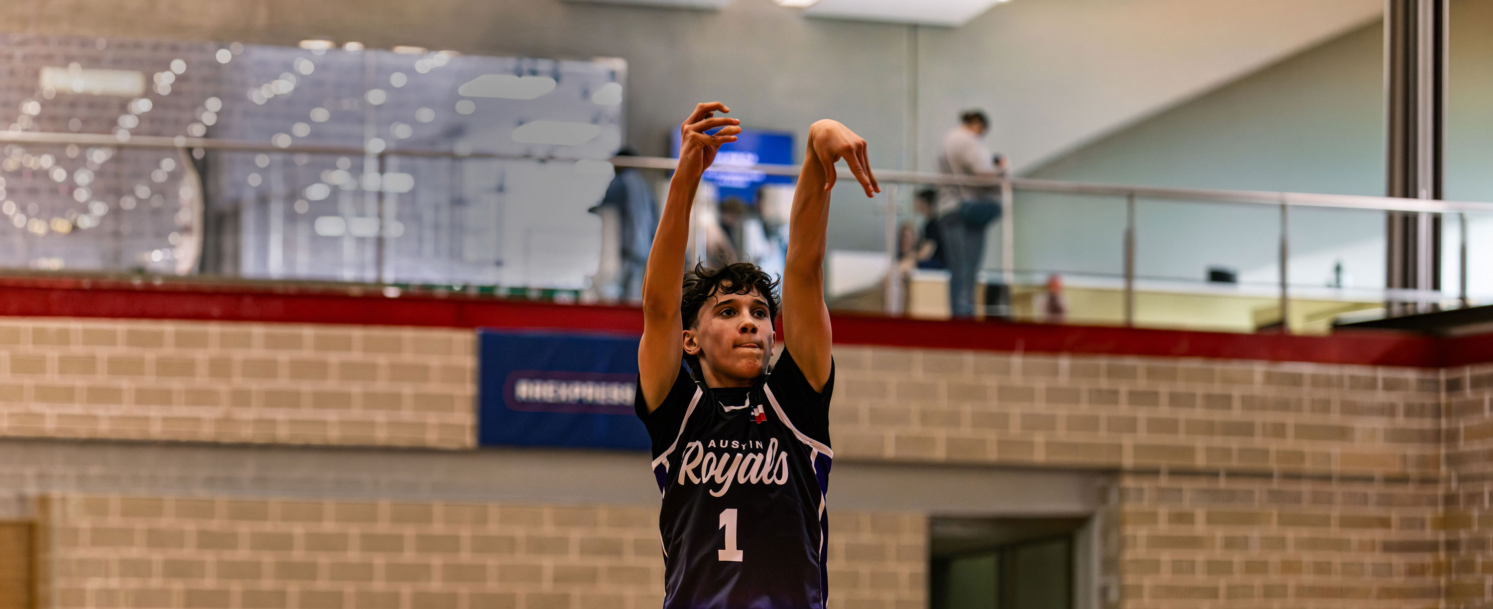 Rachel, personal trainer, looking to the side confidently in a fitness studio