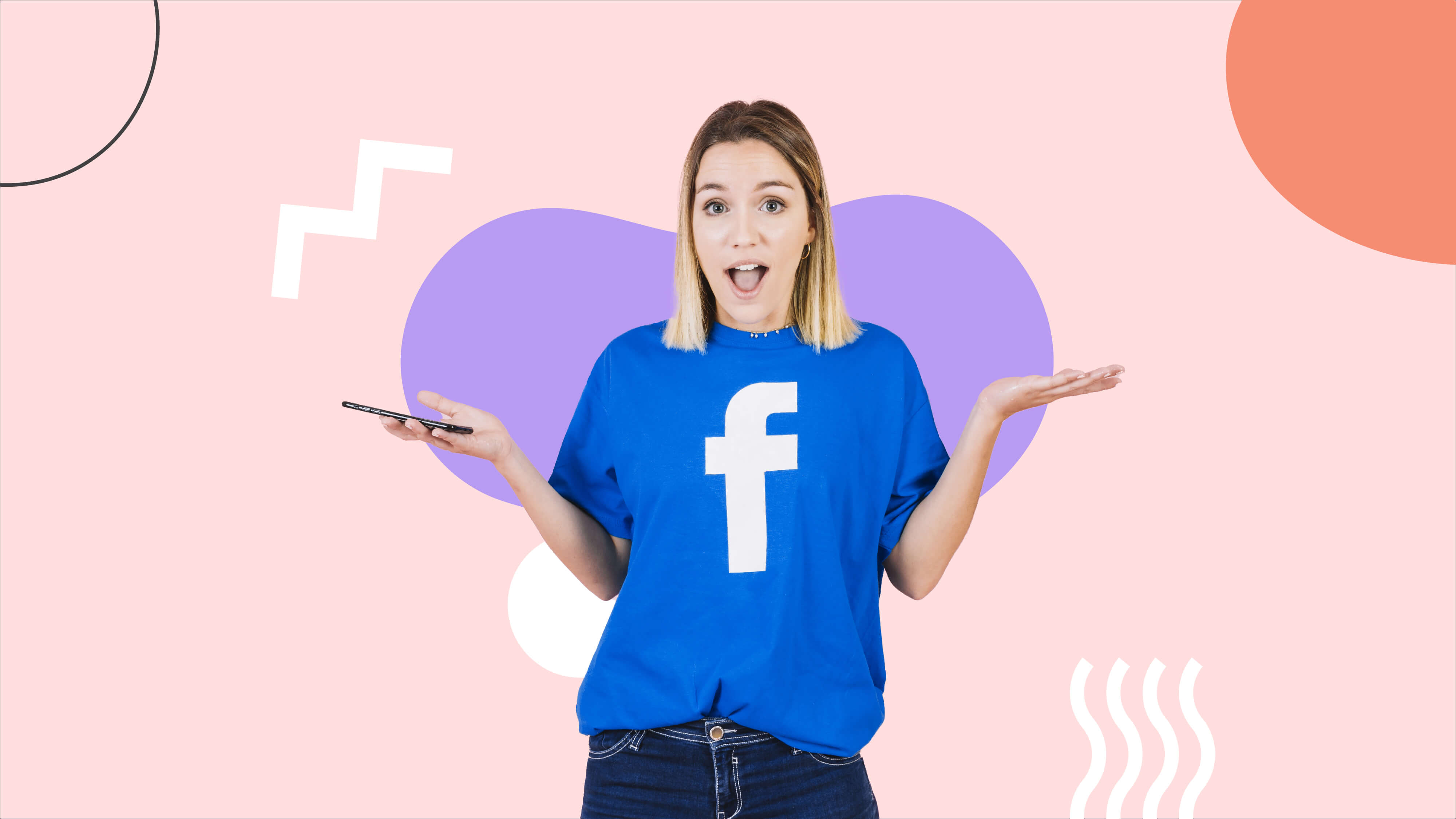 Woman holding a phone while wearing blue Facebook shirt
