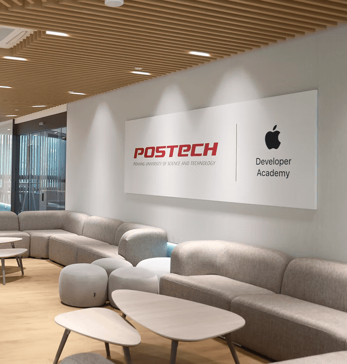 silver iMac turned on inside room