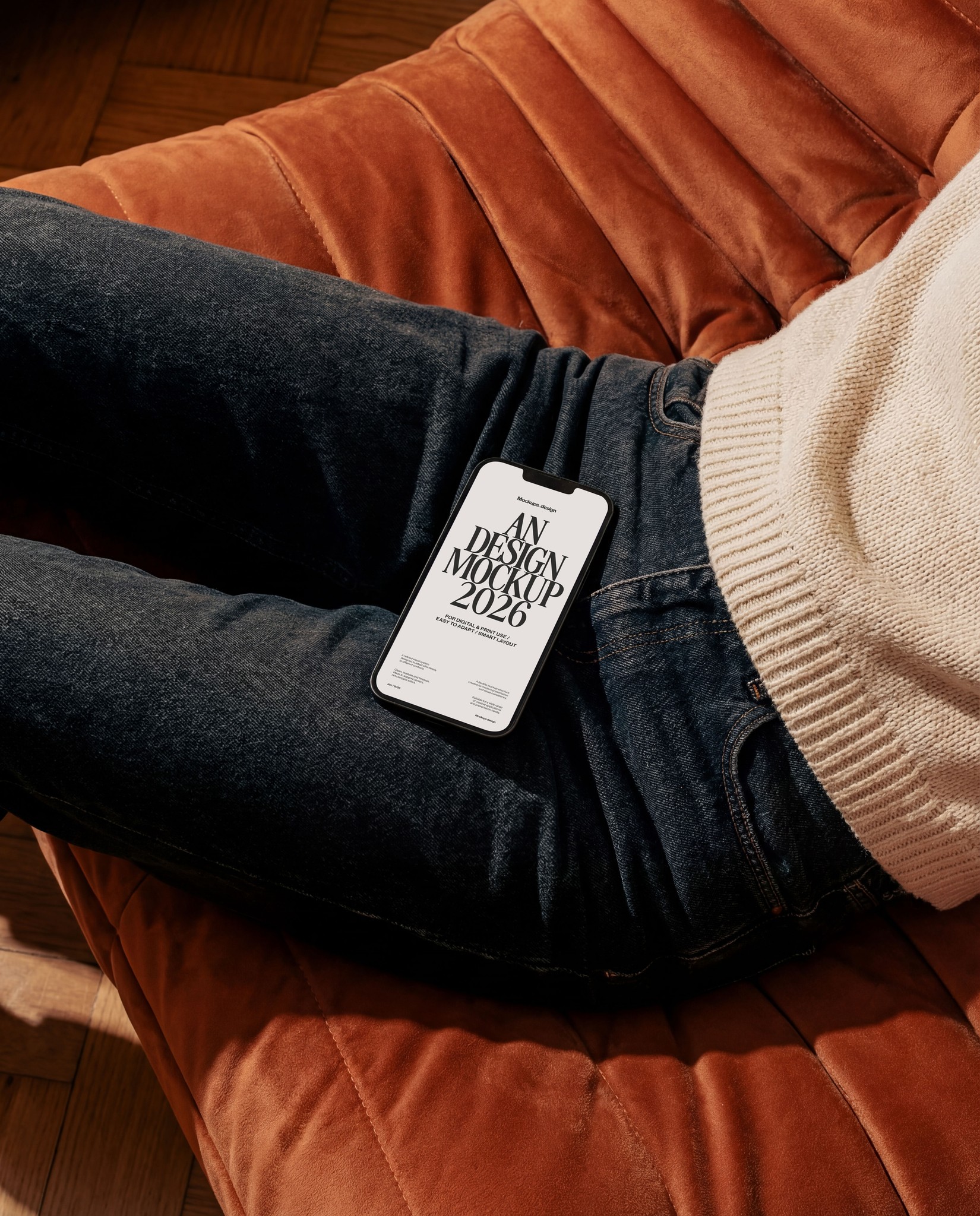 Woman holding iPhone 16 mockup on couch, natural home setting