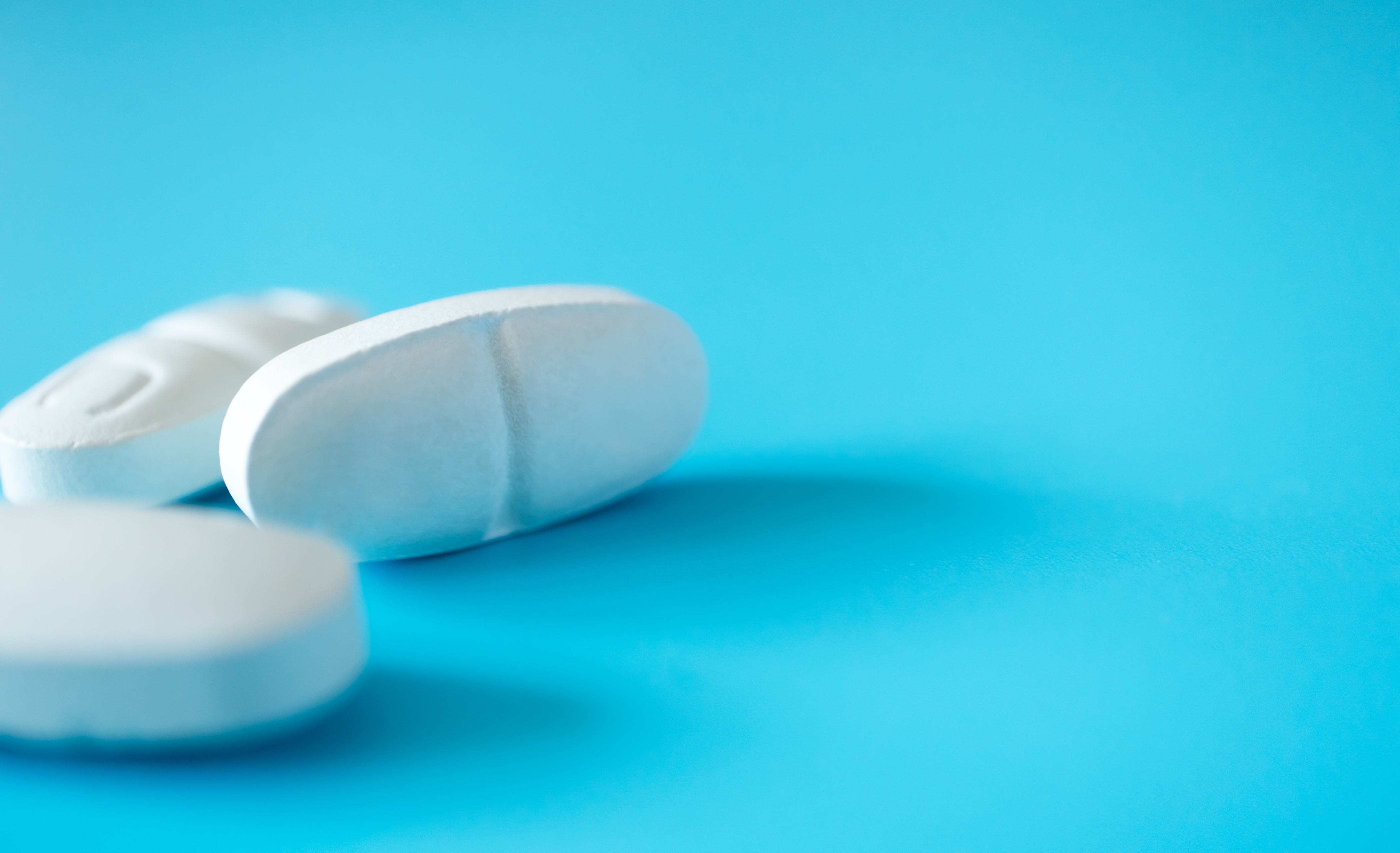 close-up-white-pills-with-selective-focus-on-blue-2026-01-07-01-03-41-utc (1).jpg