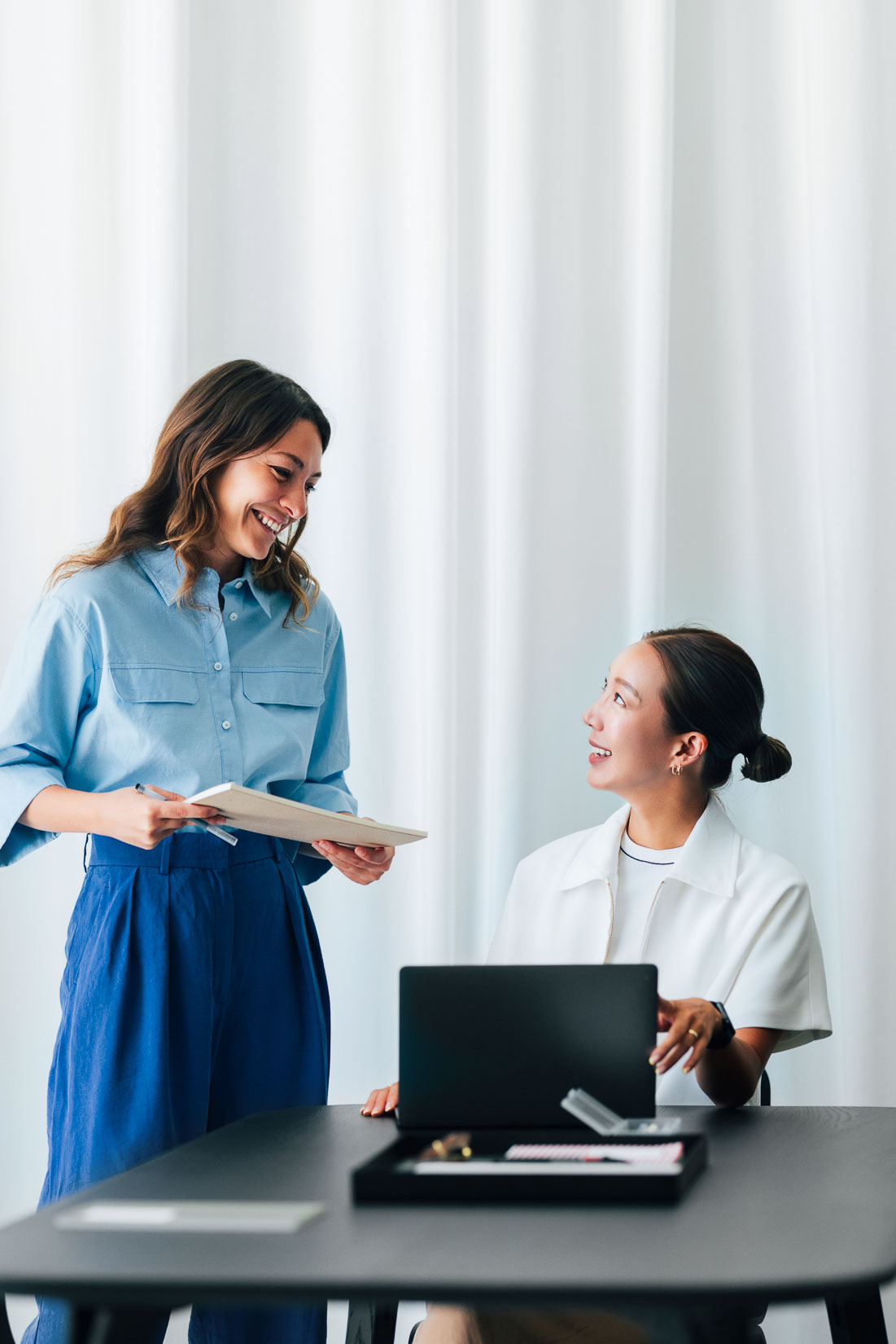 R1 visa lawyer consulting with colleague in office