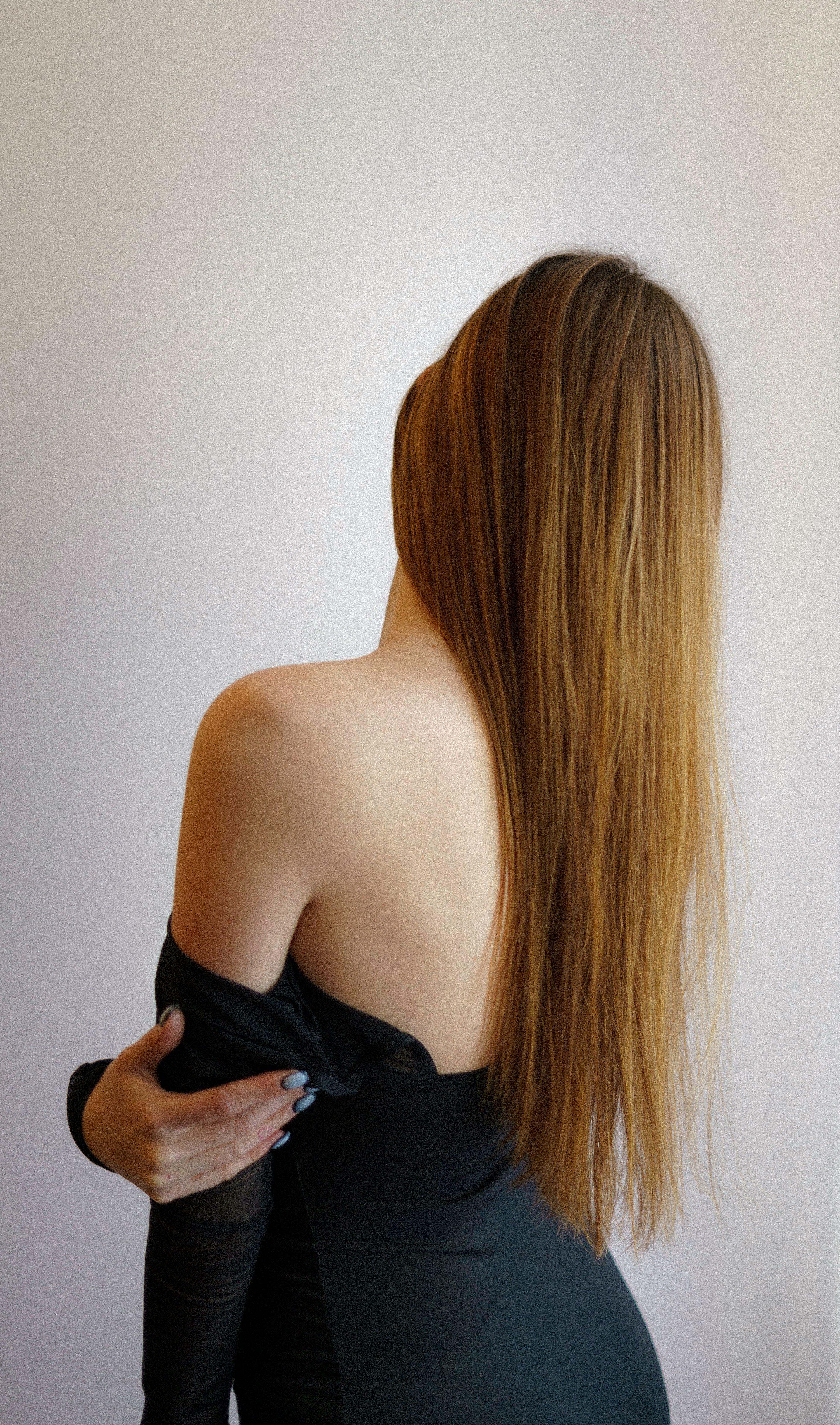 a woman in a black dress with long hair