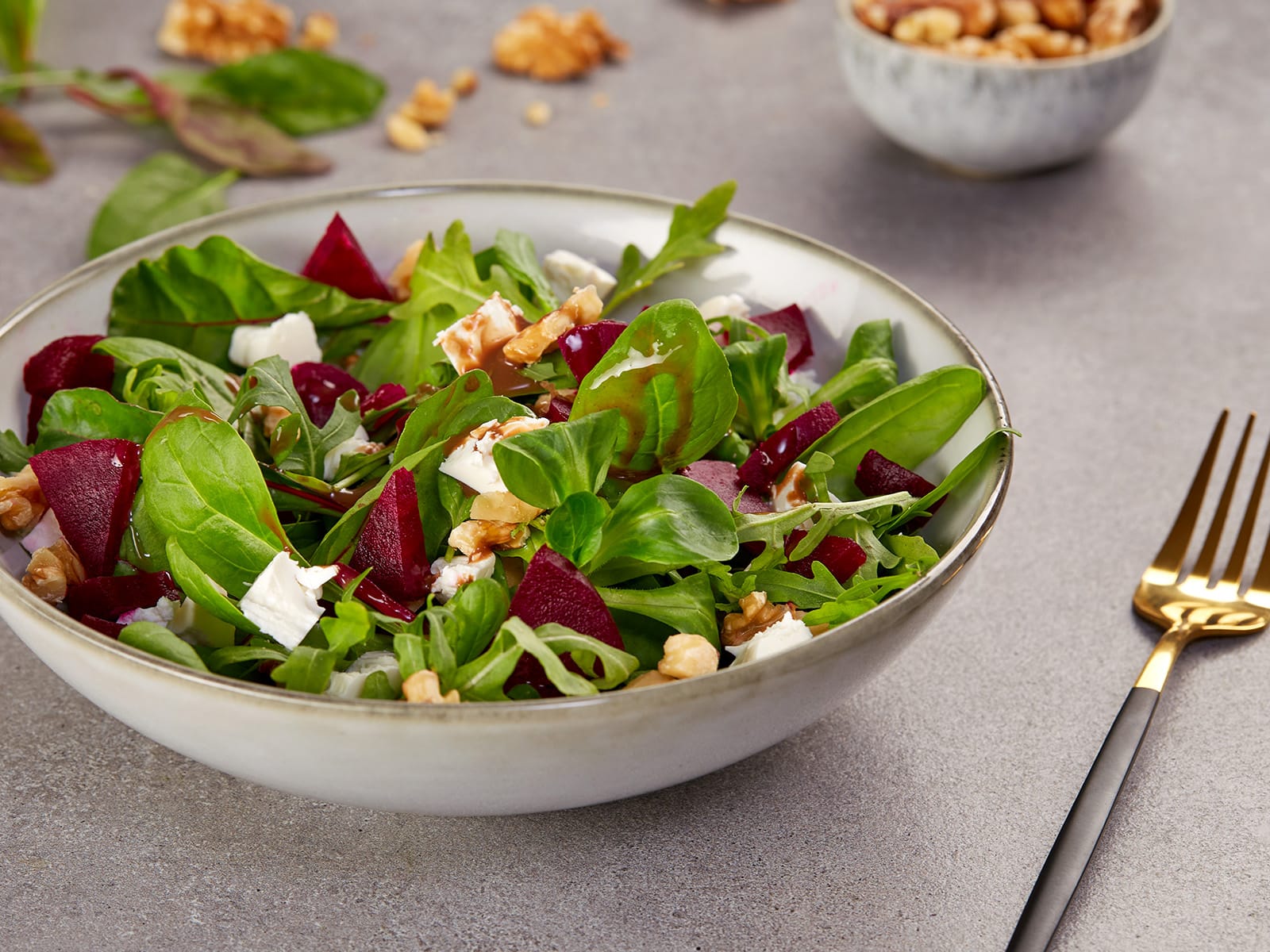 Fresh beetroot and green salad photographed in a modern food photography style for recipes and culinary content