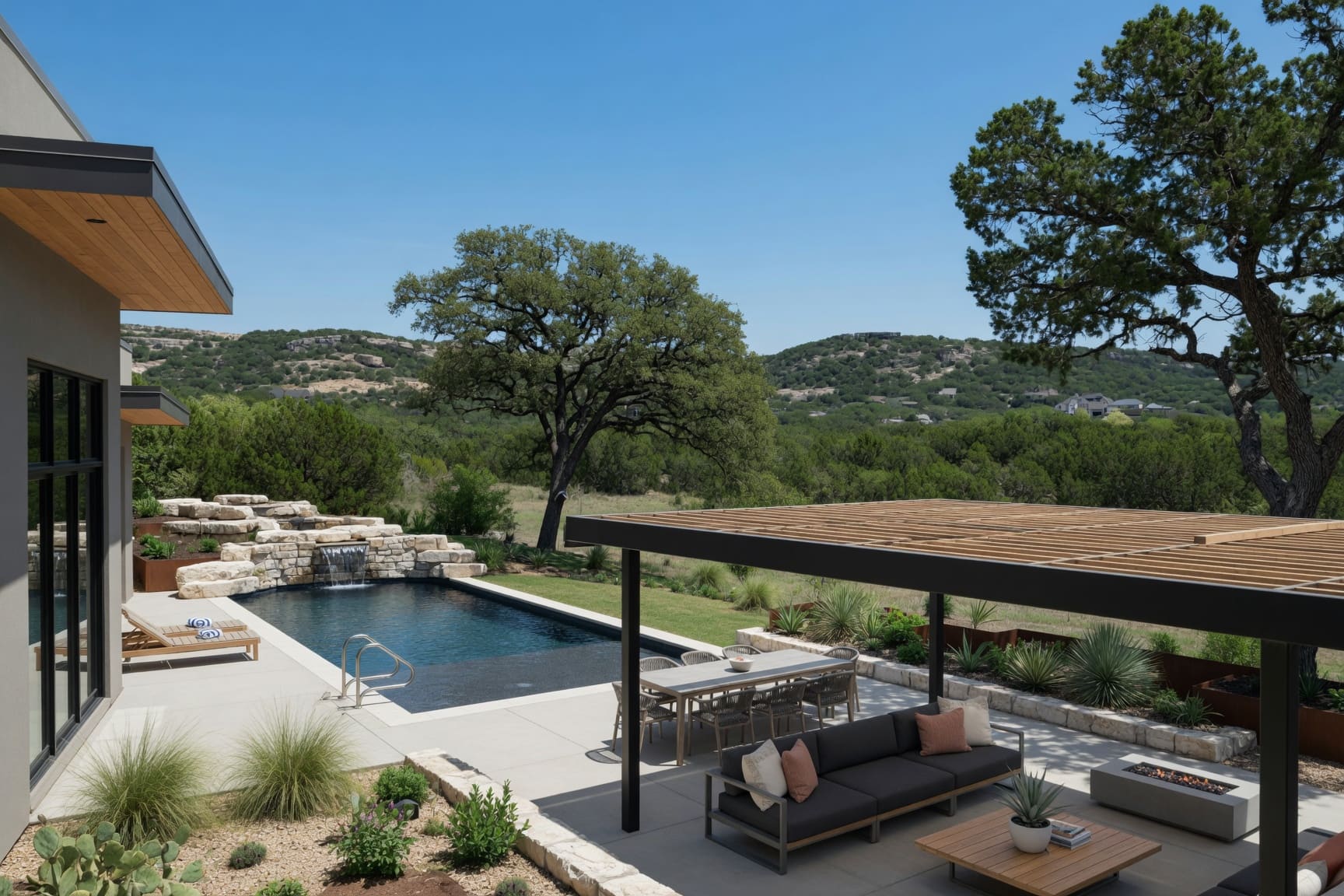 Infinity pool and covered outdoor lounge with Hill Country views