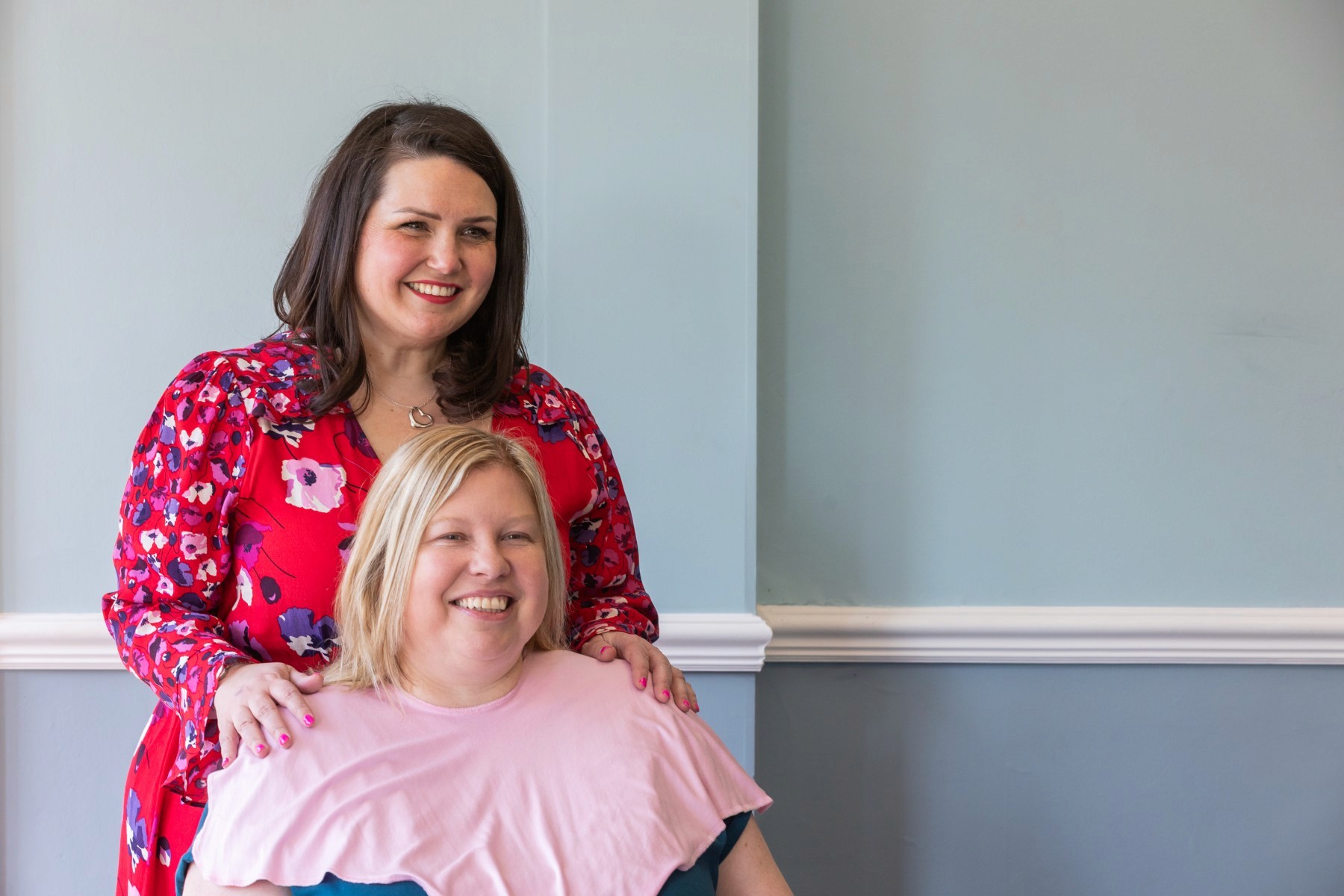A solitary palm tree against a clear blue sky