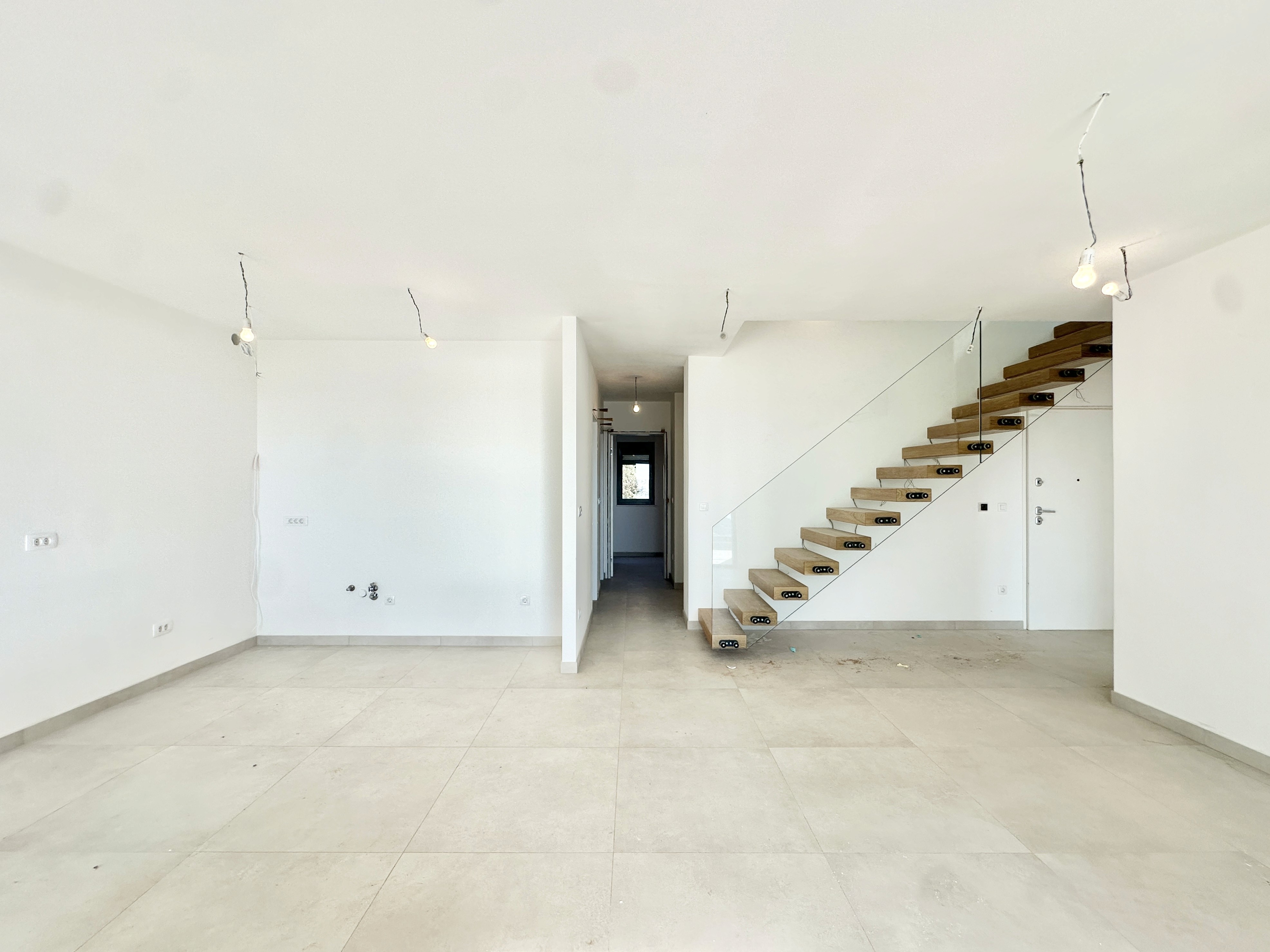 Ornate classic bathroom with claw-foot tub and wood paneling.