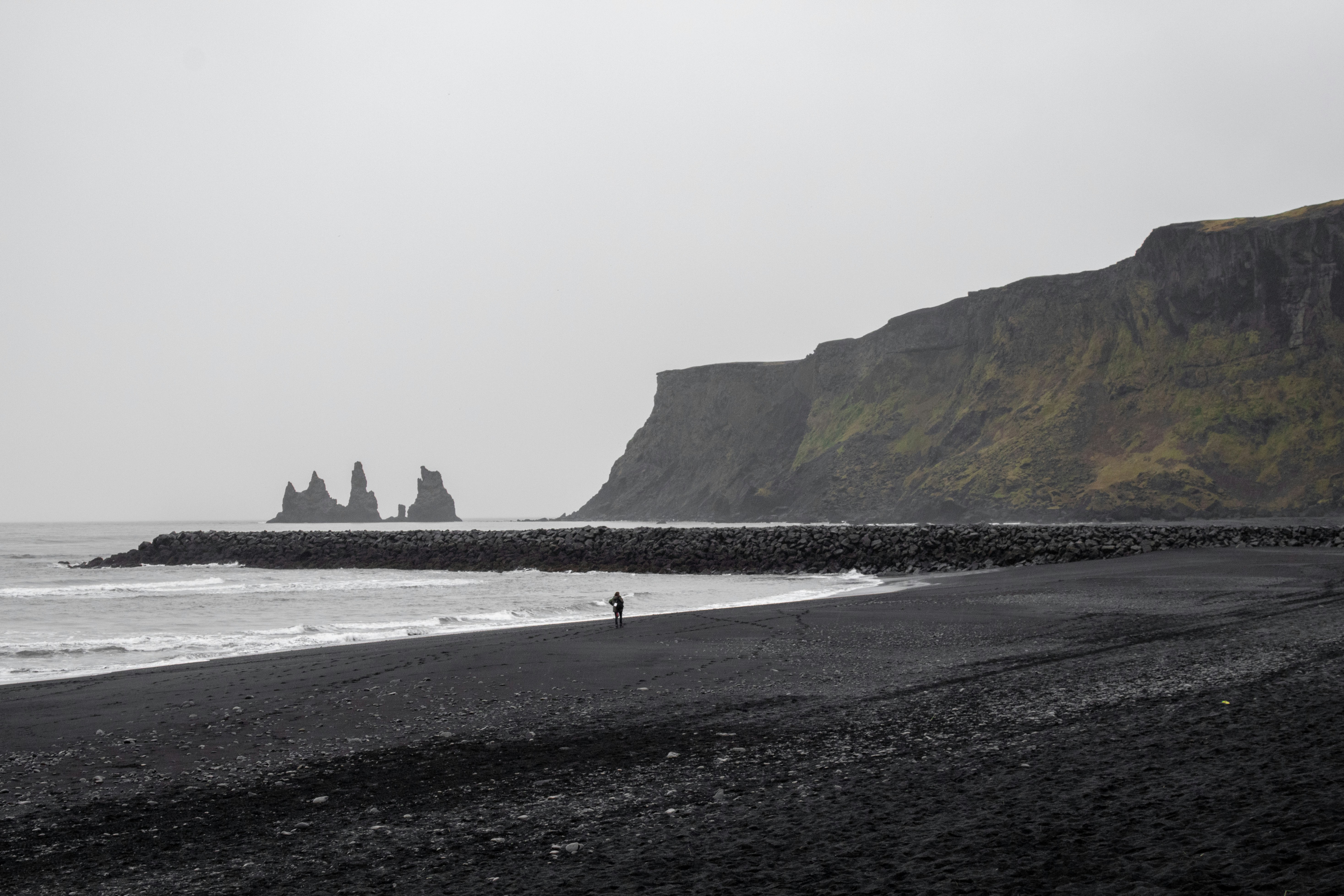 Víkurfjara Black Sand Beach with Reynisdrangar Sea Stacks in the background.