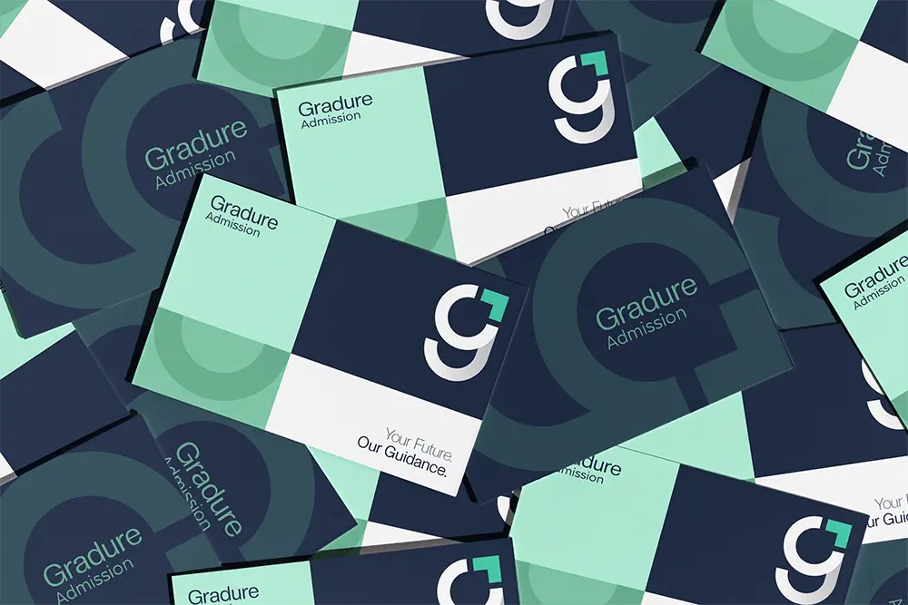 Scattered stack of Gradure Admission brand cards featuring bold geometric layouts in navy, mint, and white, with the signature ‘G’ symbol and tagline ‘Your Future, Our Guidance.’ displayed across various designs.