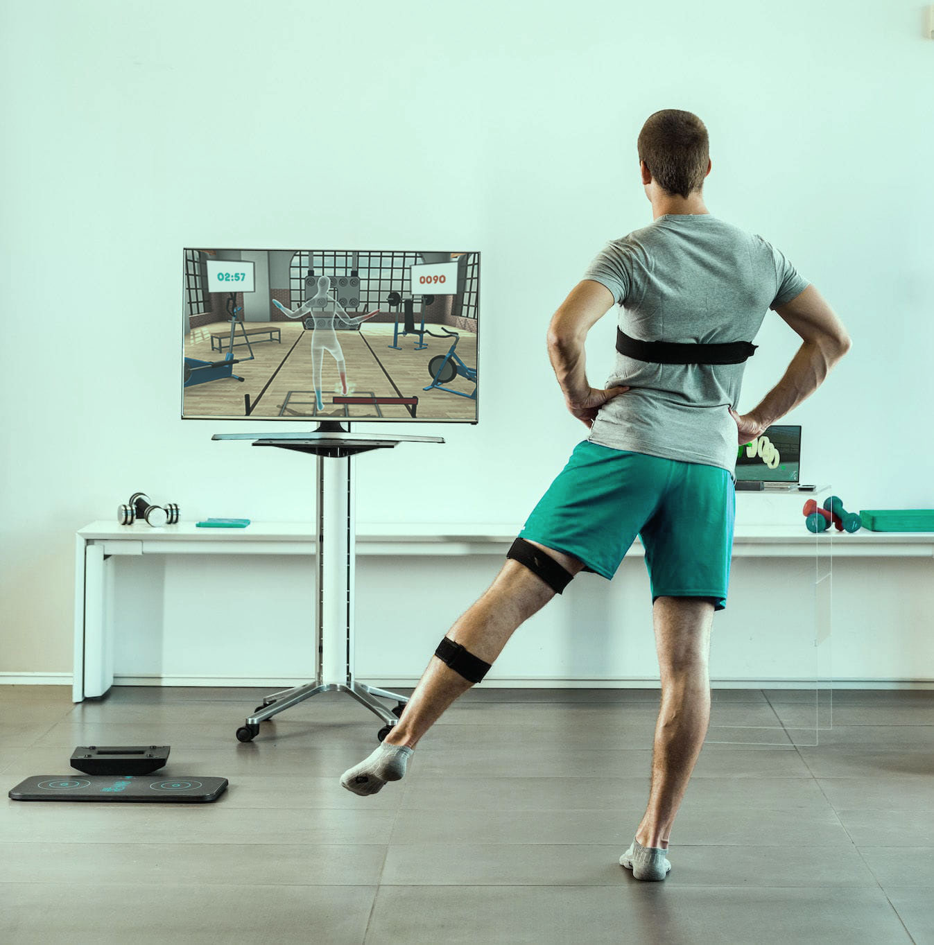 A man practicing physiotherapy with VR on screen instructions training