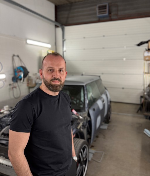 person sitting in a chair in front of a man