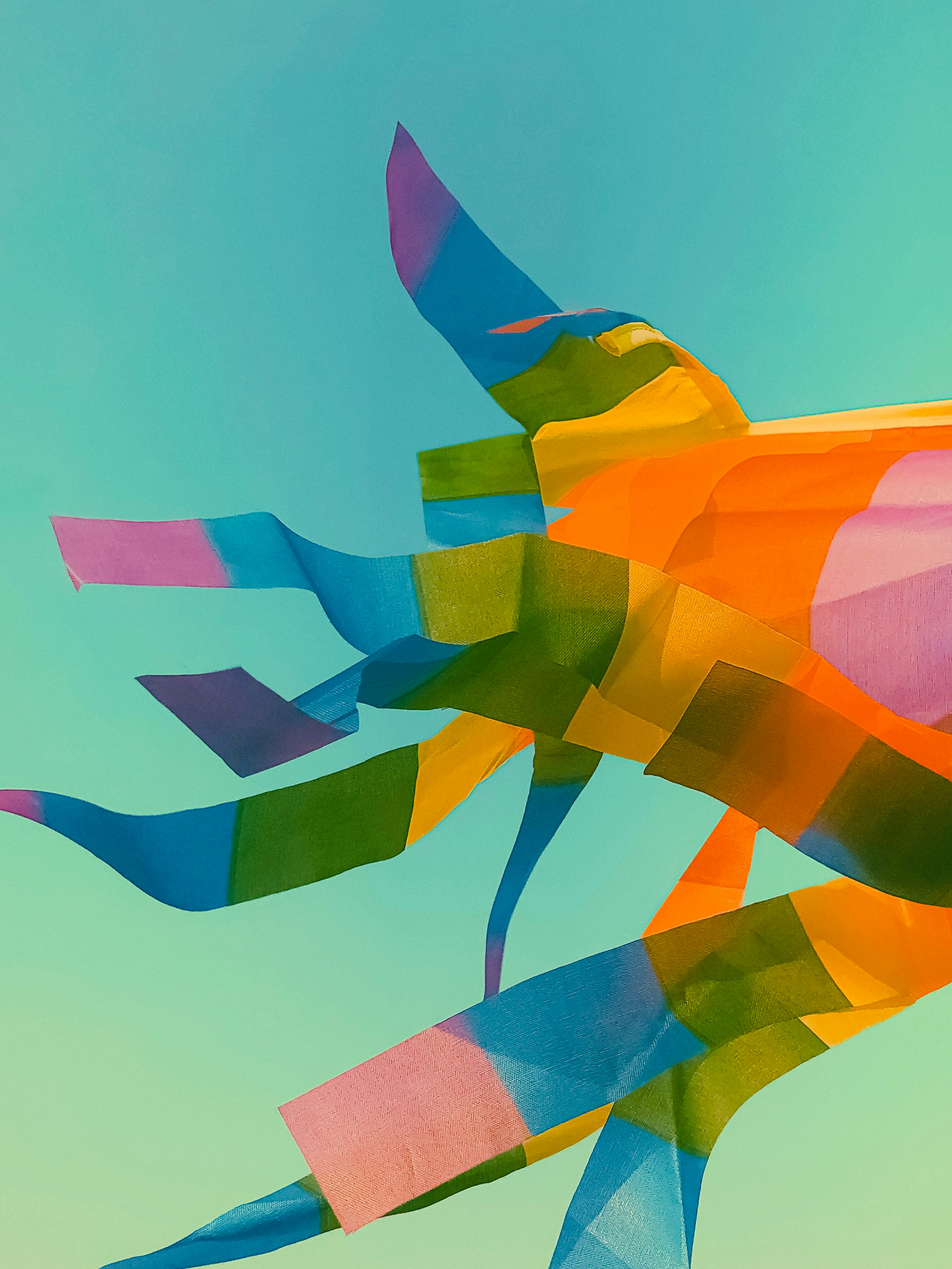 a colorful kite is flying in the sky