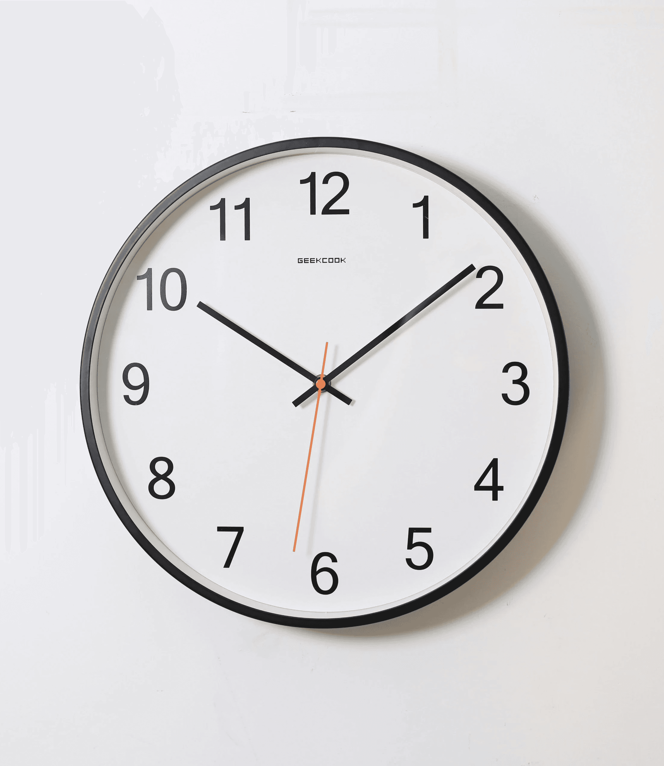 round analog wall clock pointing at 10:09