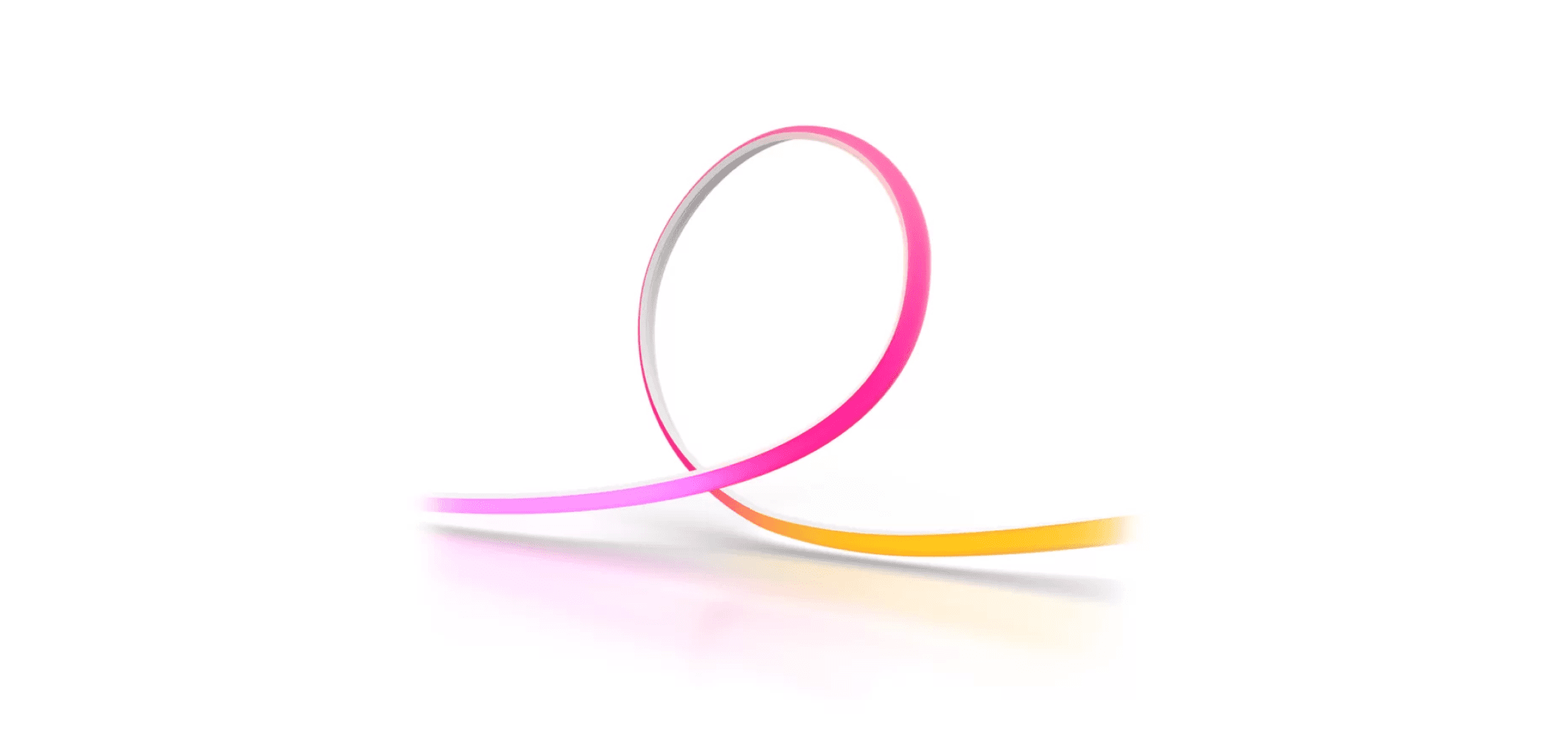 Flexible LED light strip glowing in gradient hues of pink, purple, and orange on a white background.