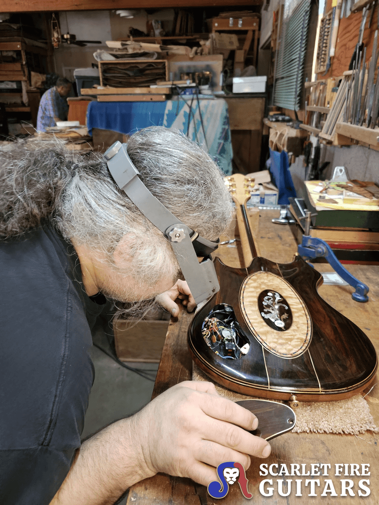 Leo Elliot inspecting Jerry Garcia's Tiger guitar in Doug Irwin's shop