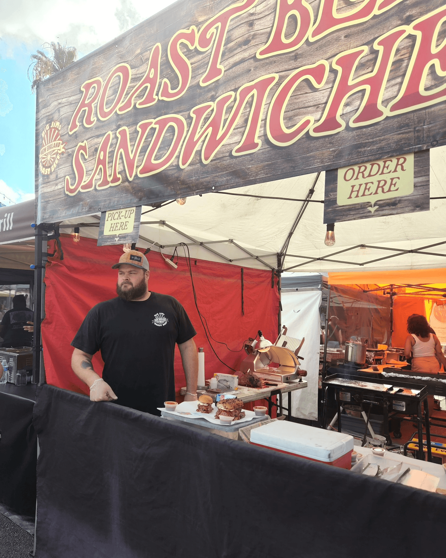 Big Jim serving Massachusetts-style roast beef sandwiches at a local San Diego farmers market, showcasing the original North Shore flavor that inspired Big Jim’s Roast Beef in Pacific Beach.