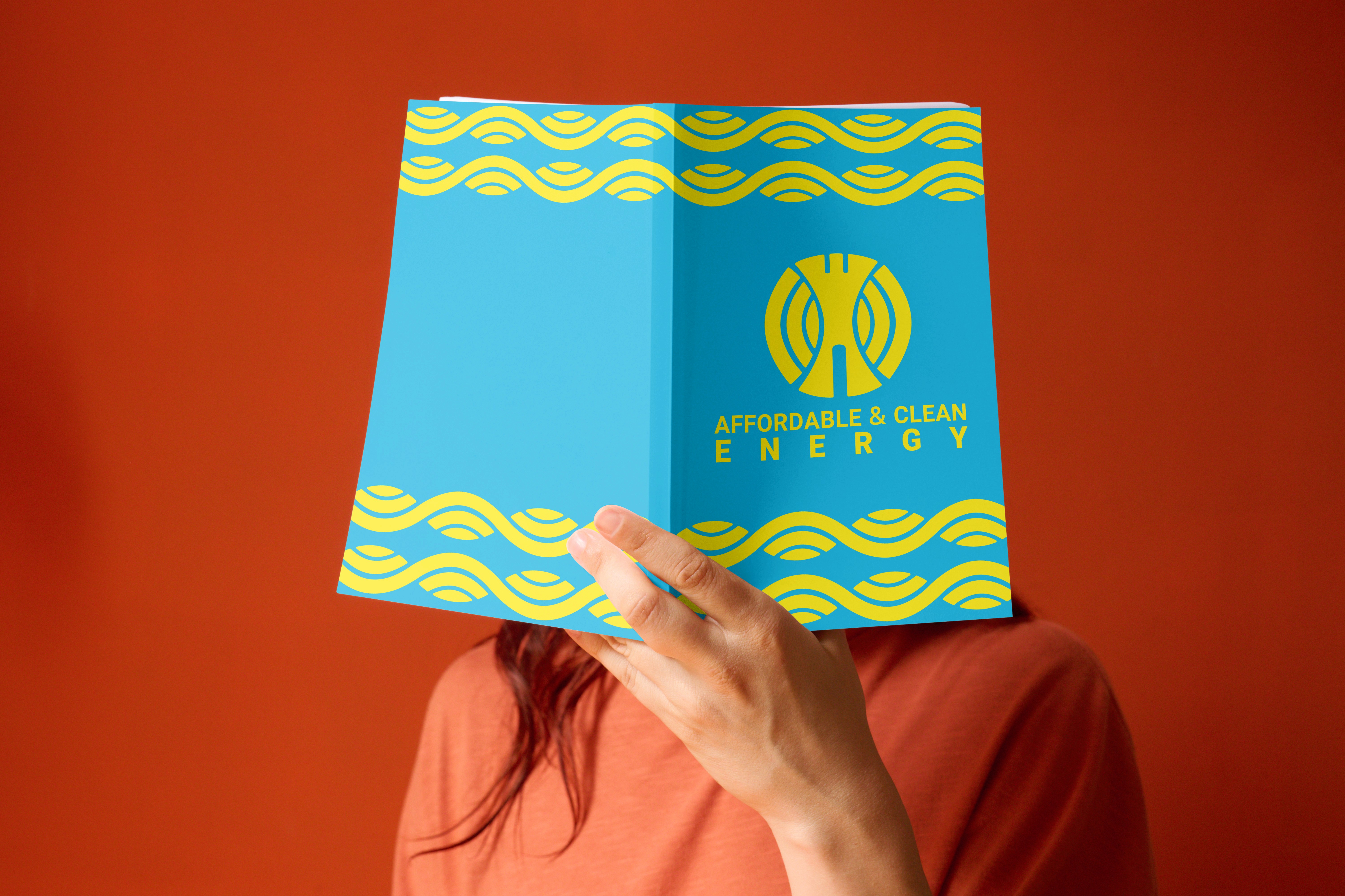 woman in red knit sweater holding lemon