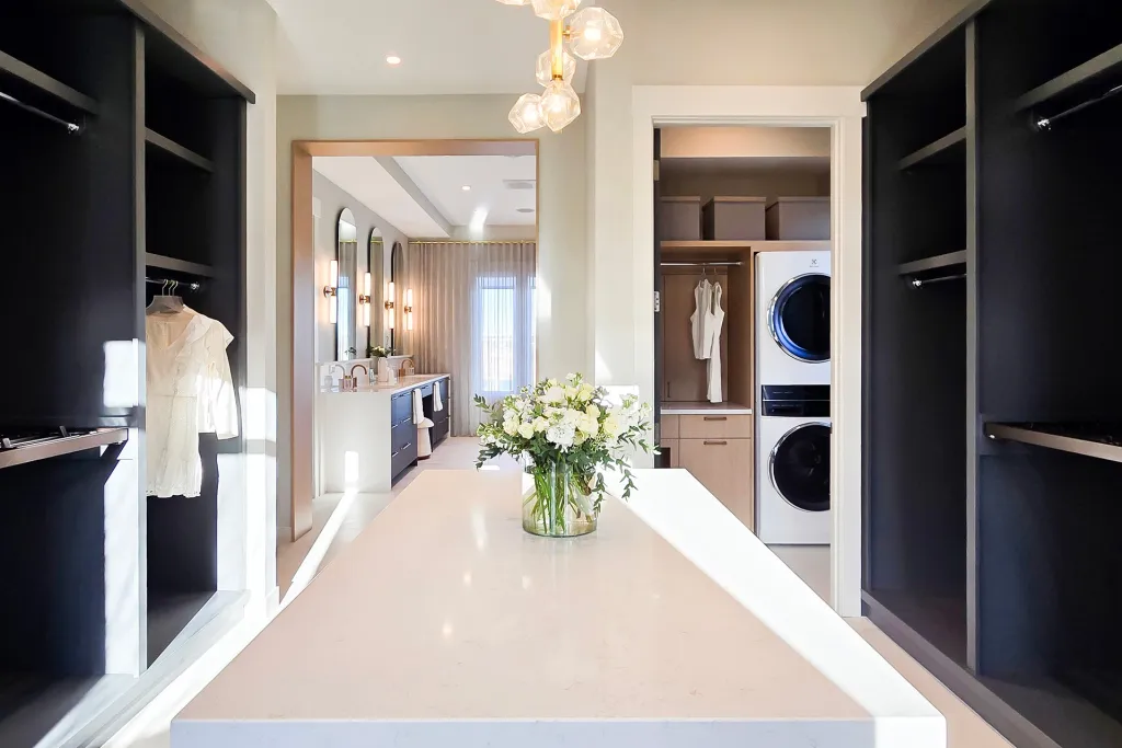 Image of Luxurious primary suite with spacious walk-in closet and elegant spa bathroom by KHD Homes design-build team.