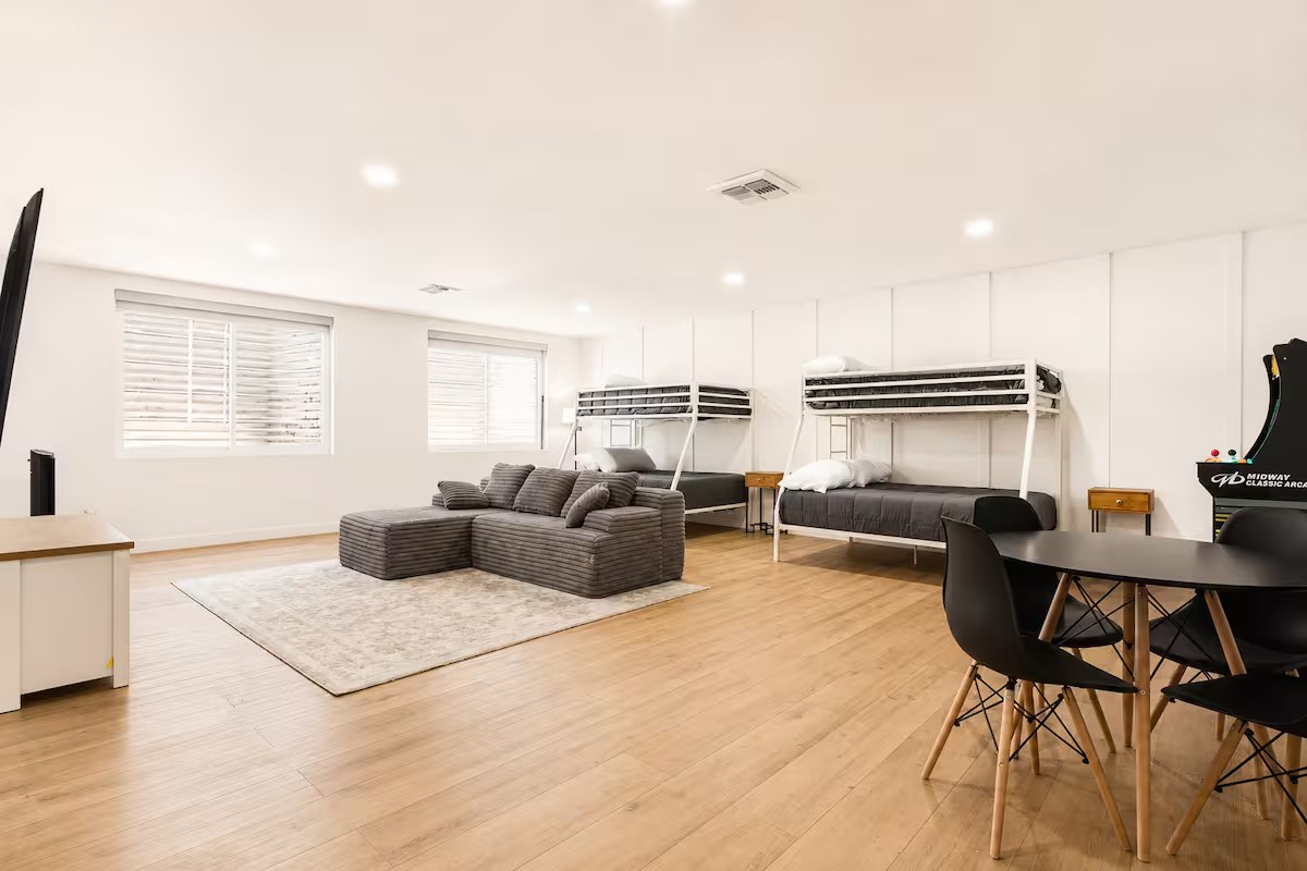 Spacious basement bunk suite with built-in beds and a lounge area