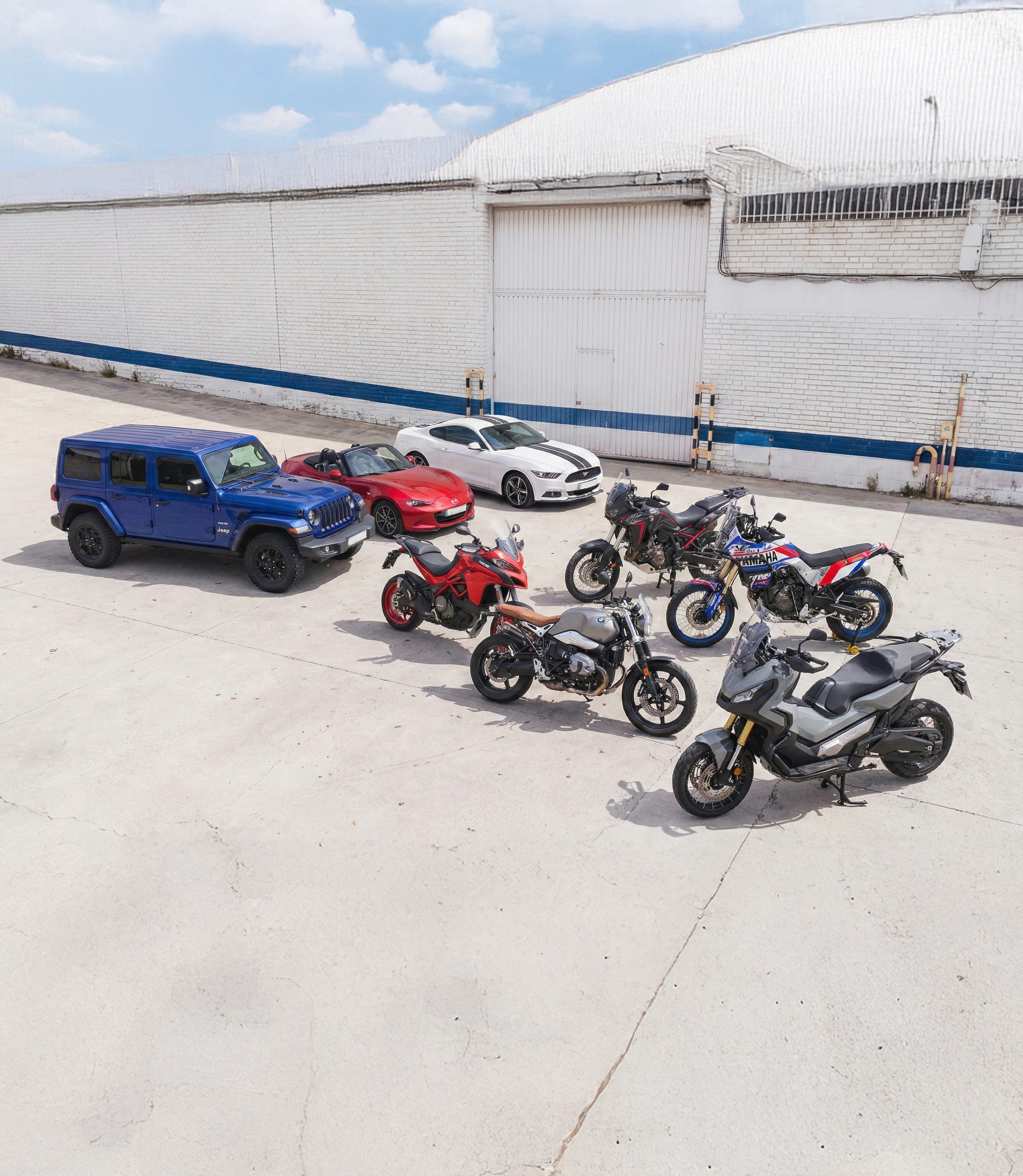 Collection of luxury sports cars displayed in modern rental showroom