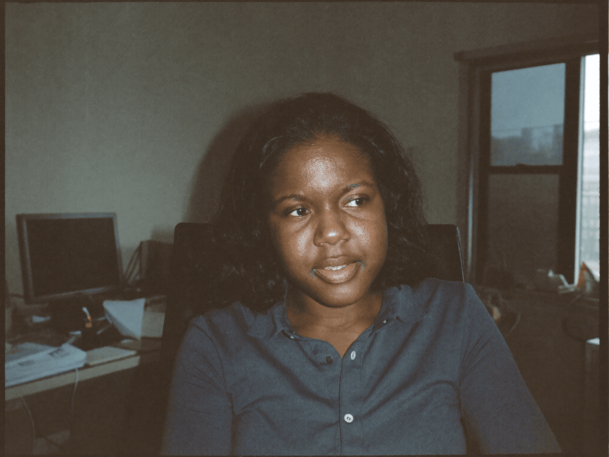 Renata Okonkwo at her desk in the Arc office