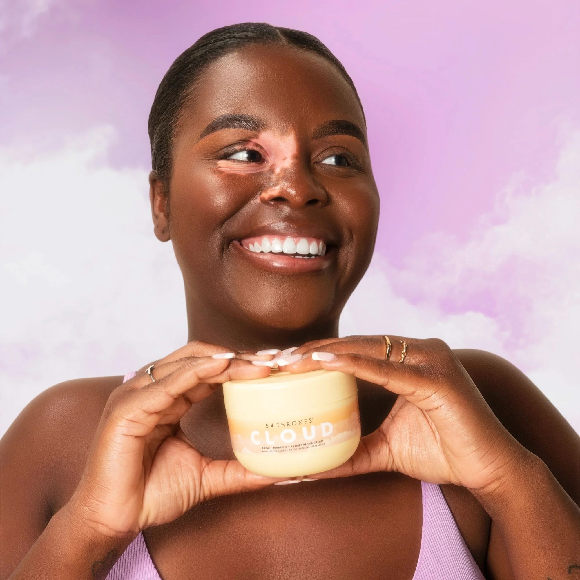 A joyful moment capturing the Cloud Cream experience — conveying softness, confidence, and radiant skin.