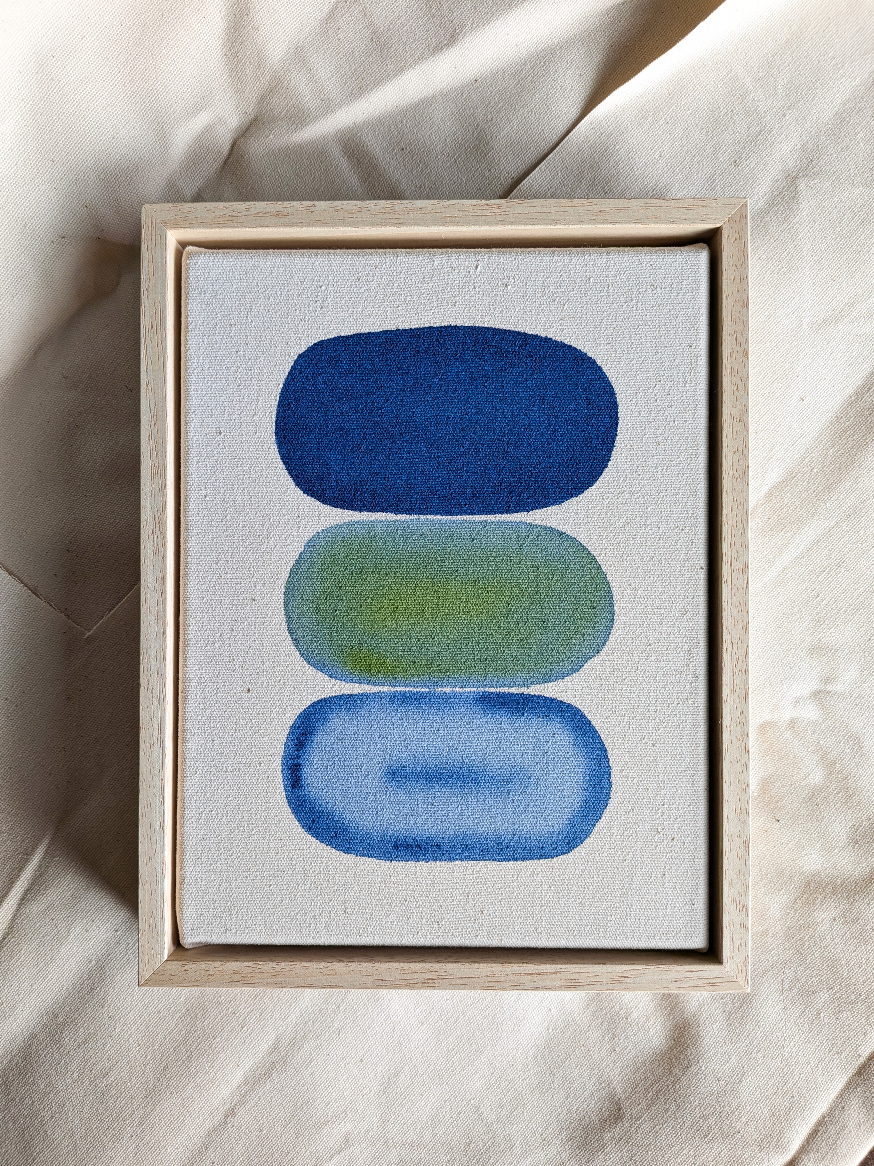 Four painting tools are laid out: a paintbrush, a screwdriver, a pencil, and a bottle of ink.
