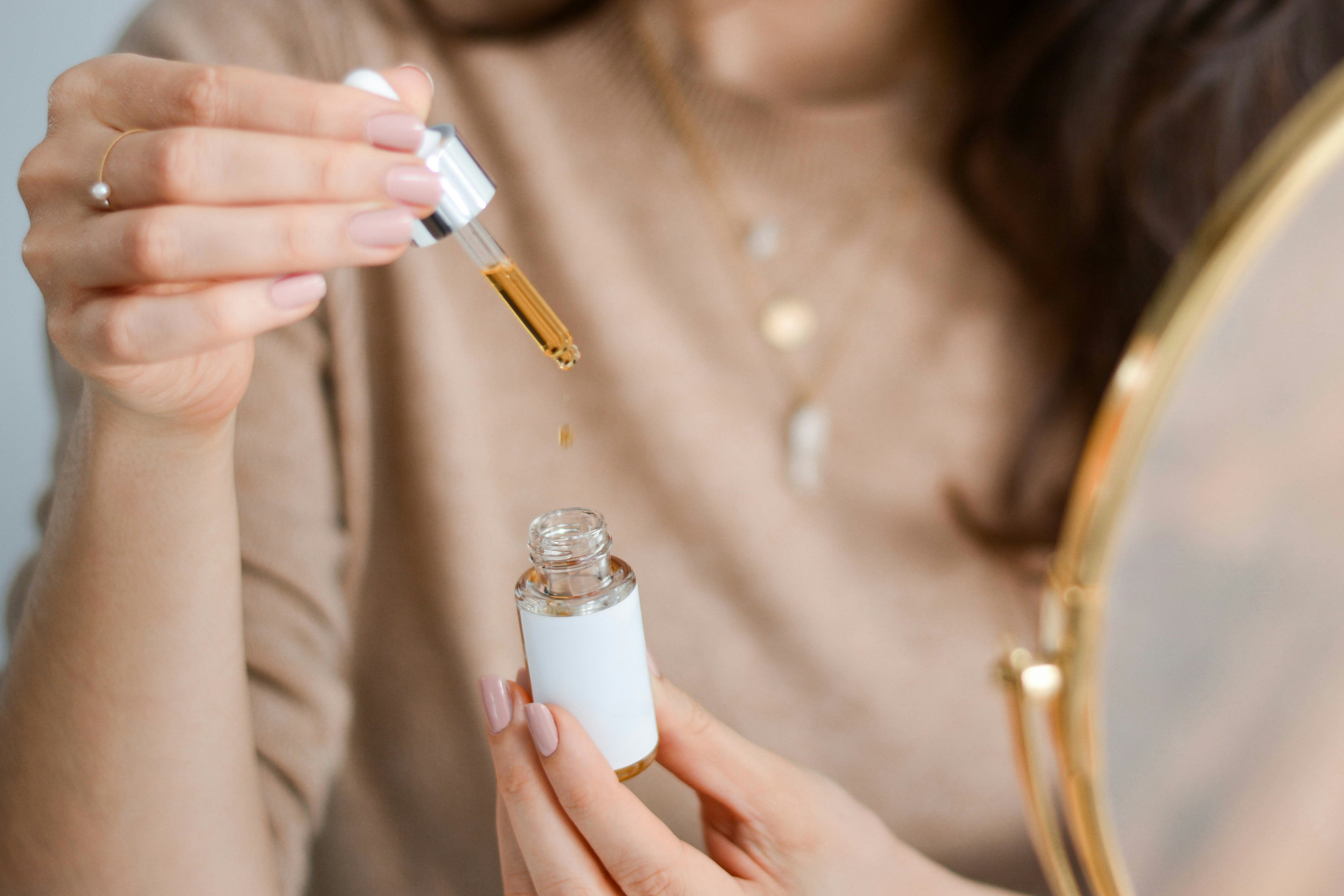 woman applying What Is Essence Skincare