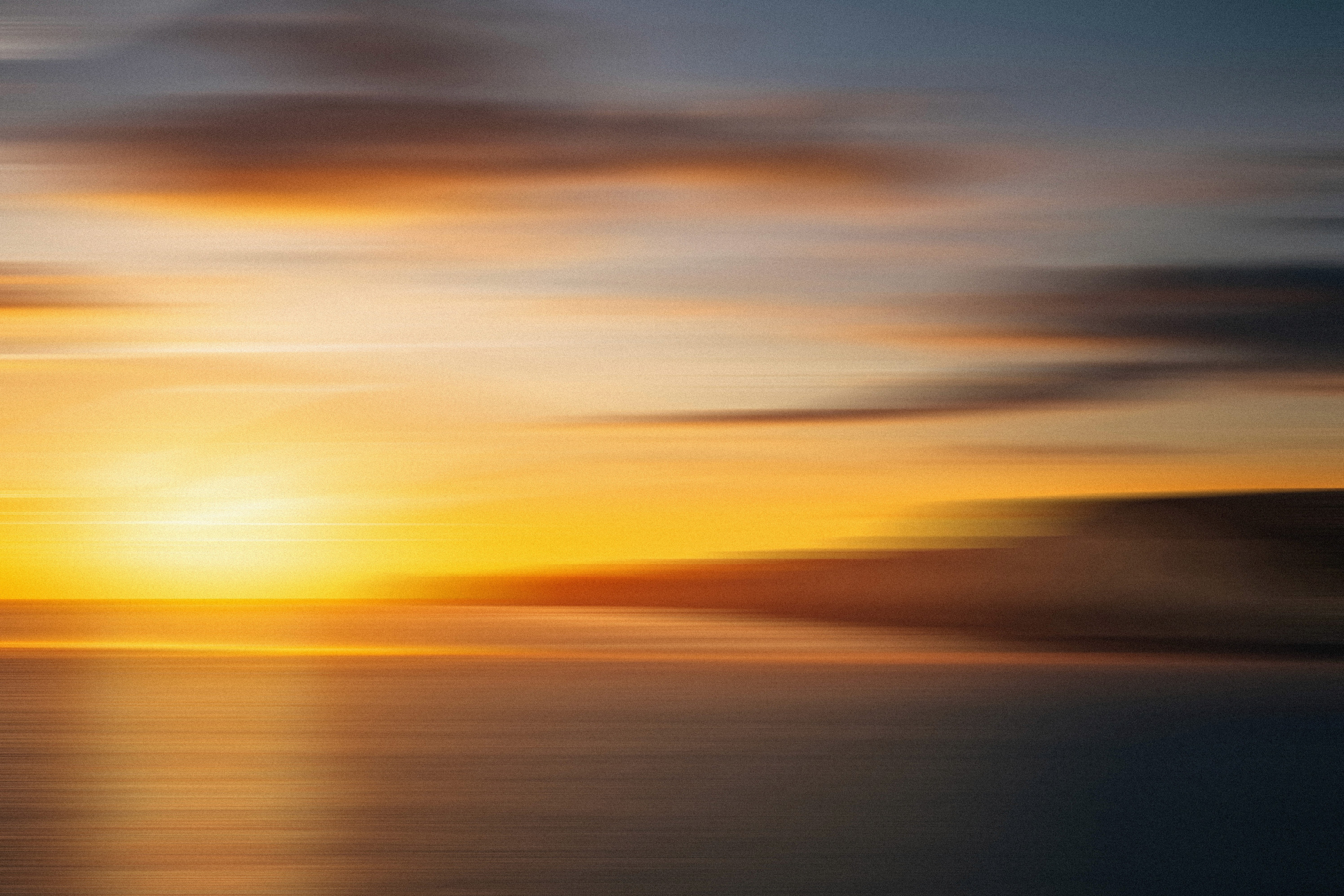 Soft pastel ocean gradient at dusk representing global leadership perspective