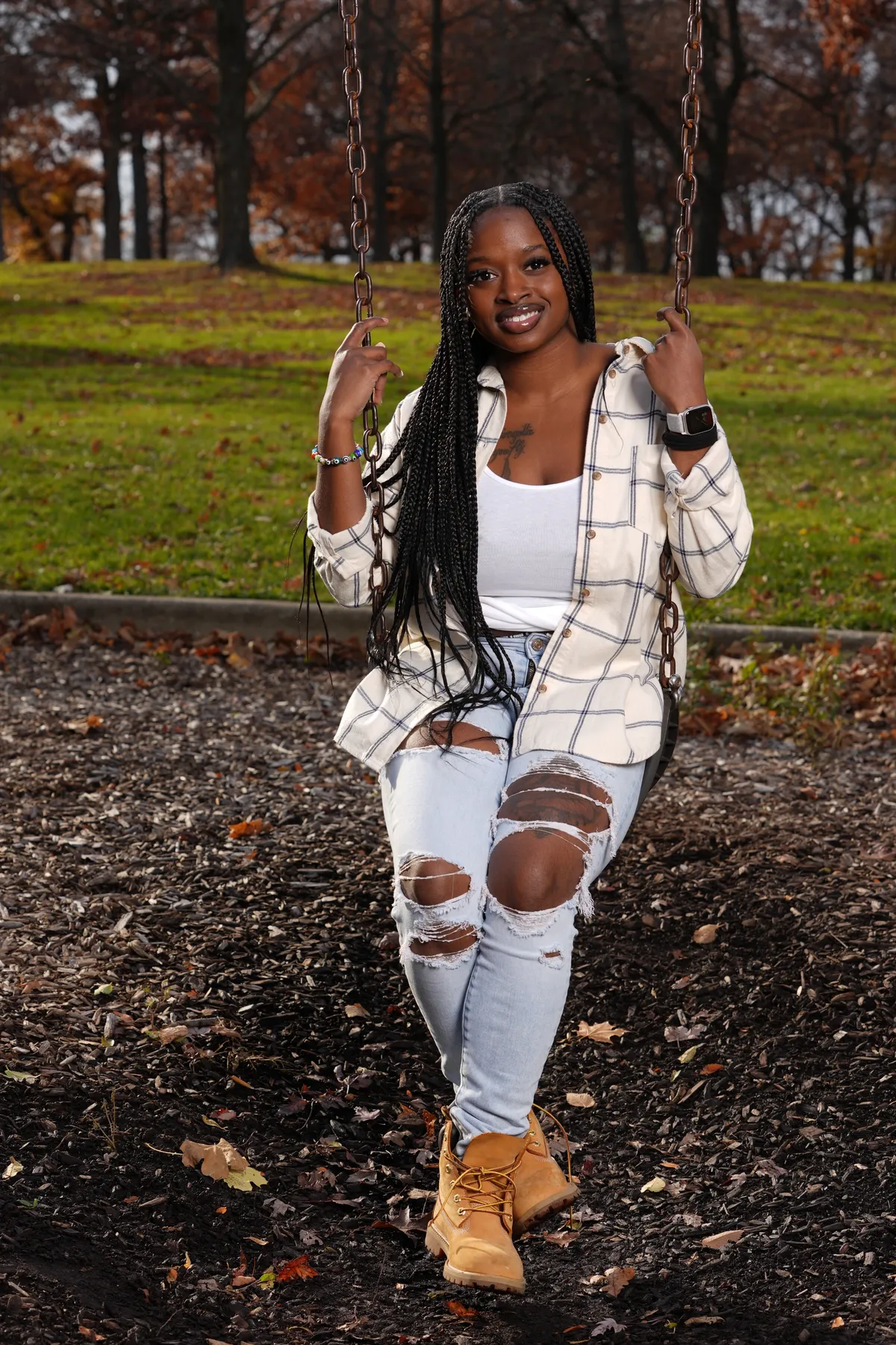 five children smiling while doing peace hand sign