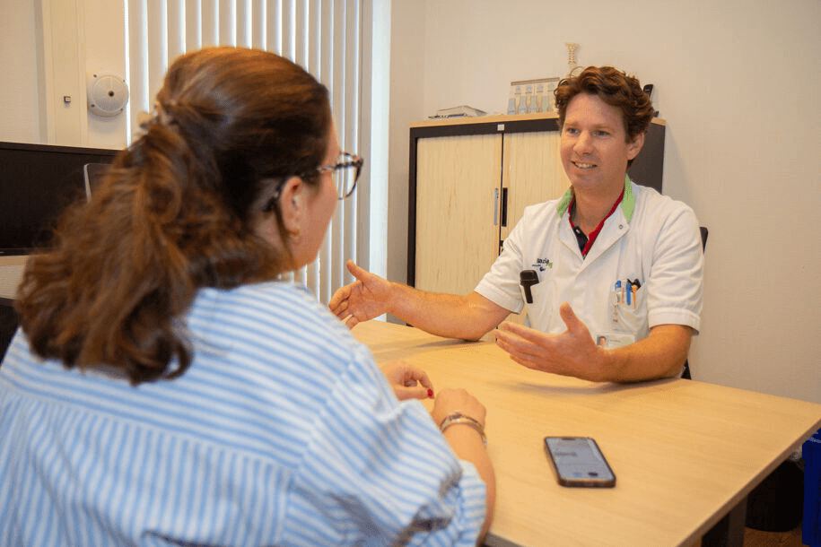 GP in conversation with a patient using the Ditto app