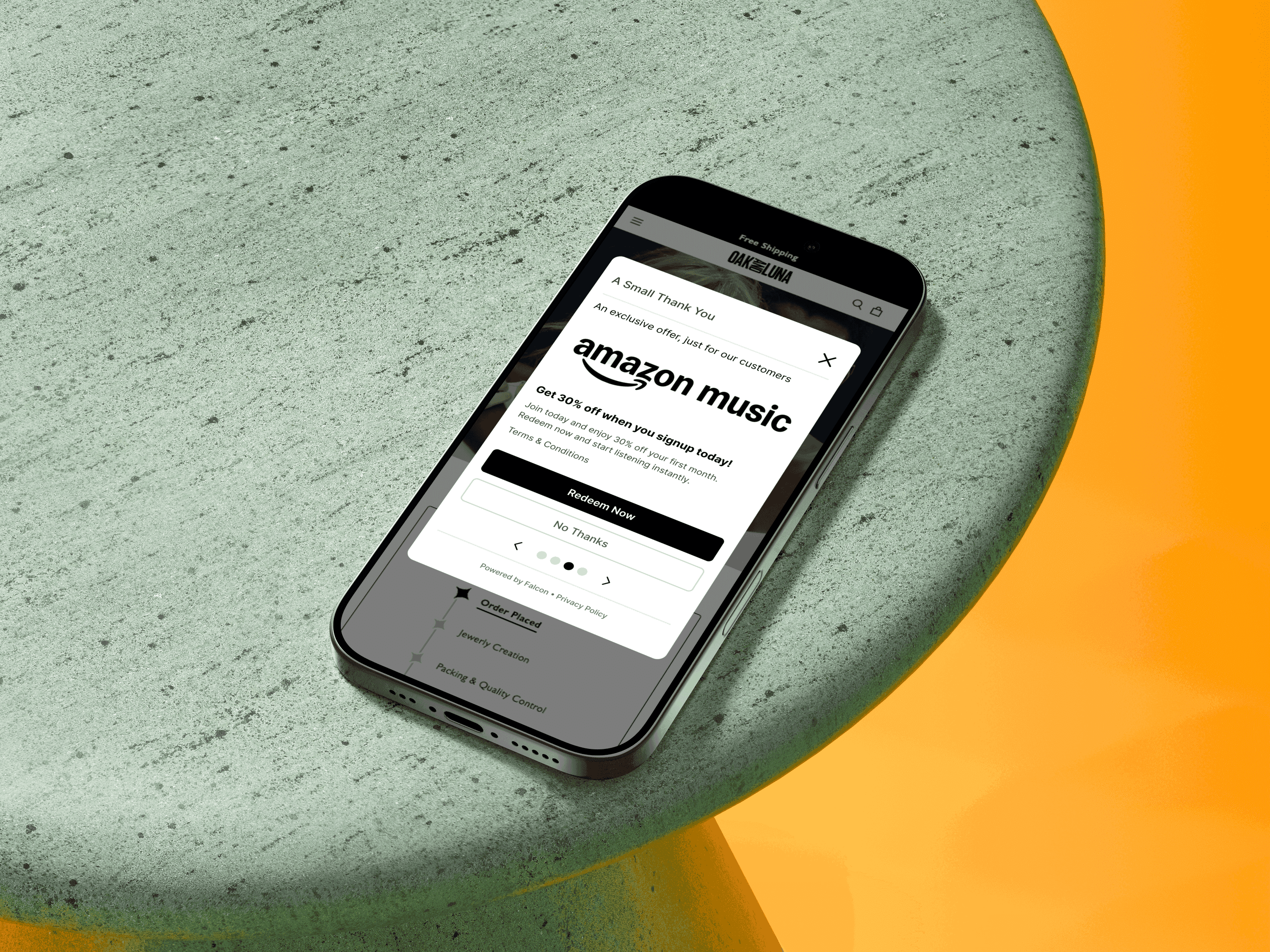 an iPhone on a table showing a Falcon ad