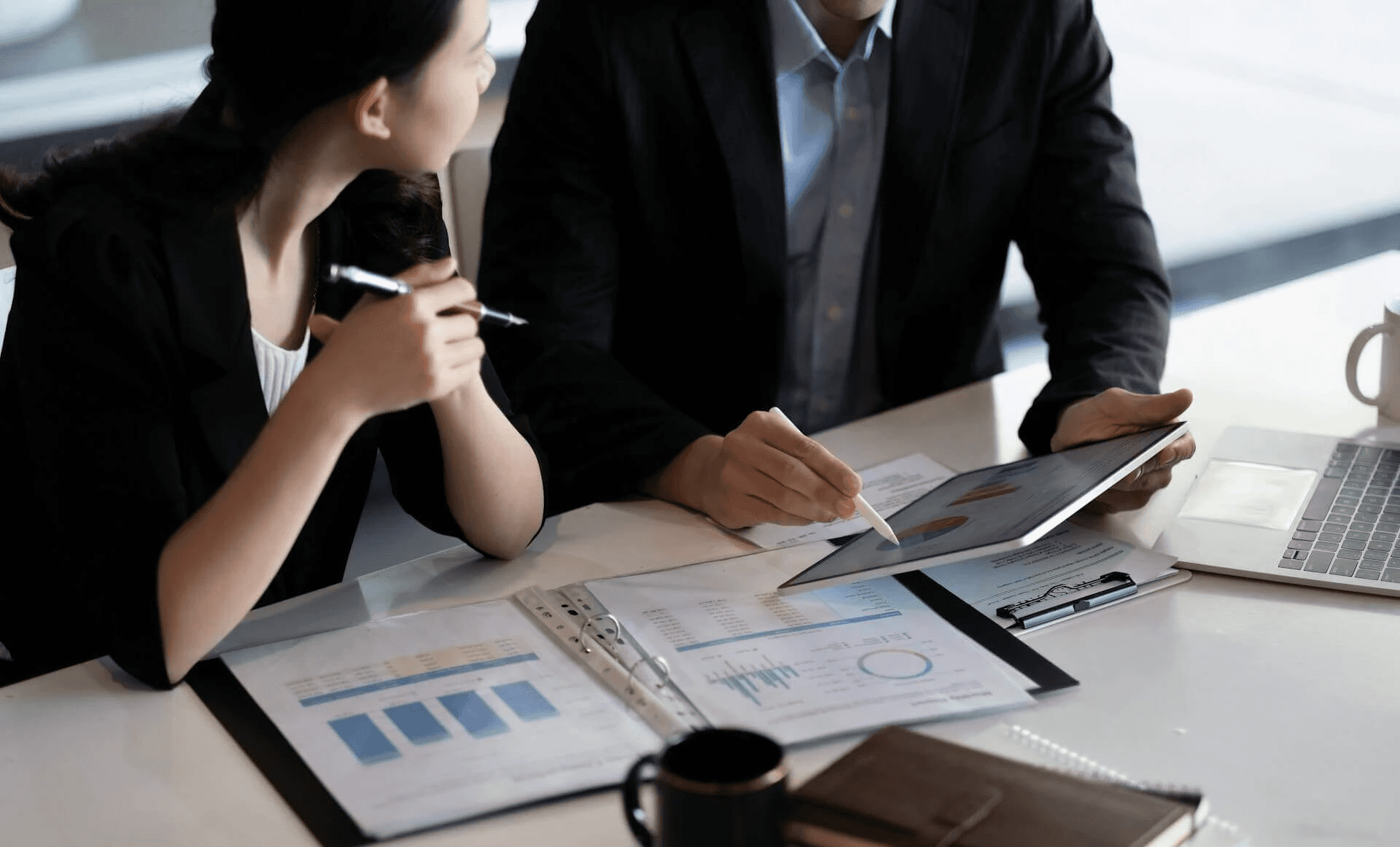 Team members discussing business data reports - Lead Qualification Best Practices