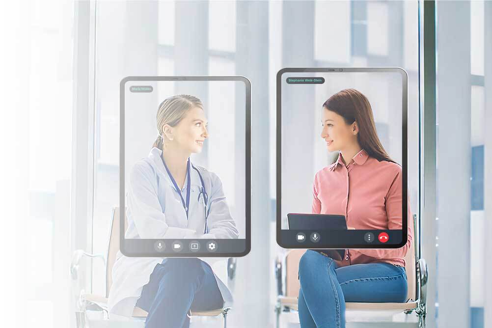 A doctor conducts a video call in a laptop