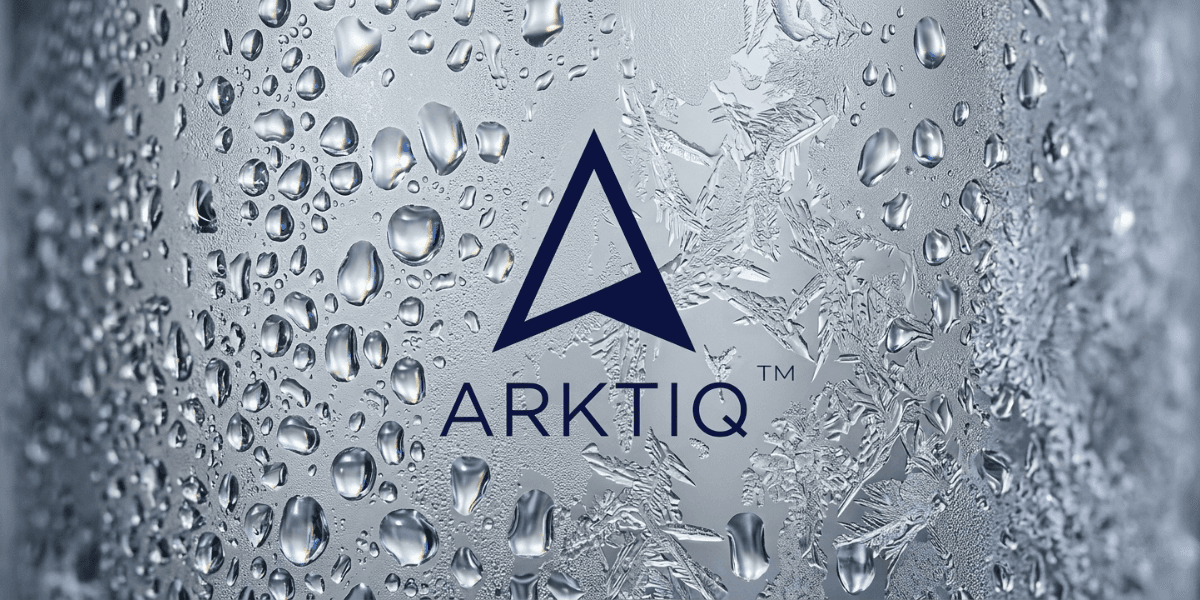 Frosted Arktiq Vodka bottle surface with water droplets and ice crystal textures.