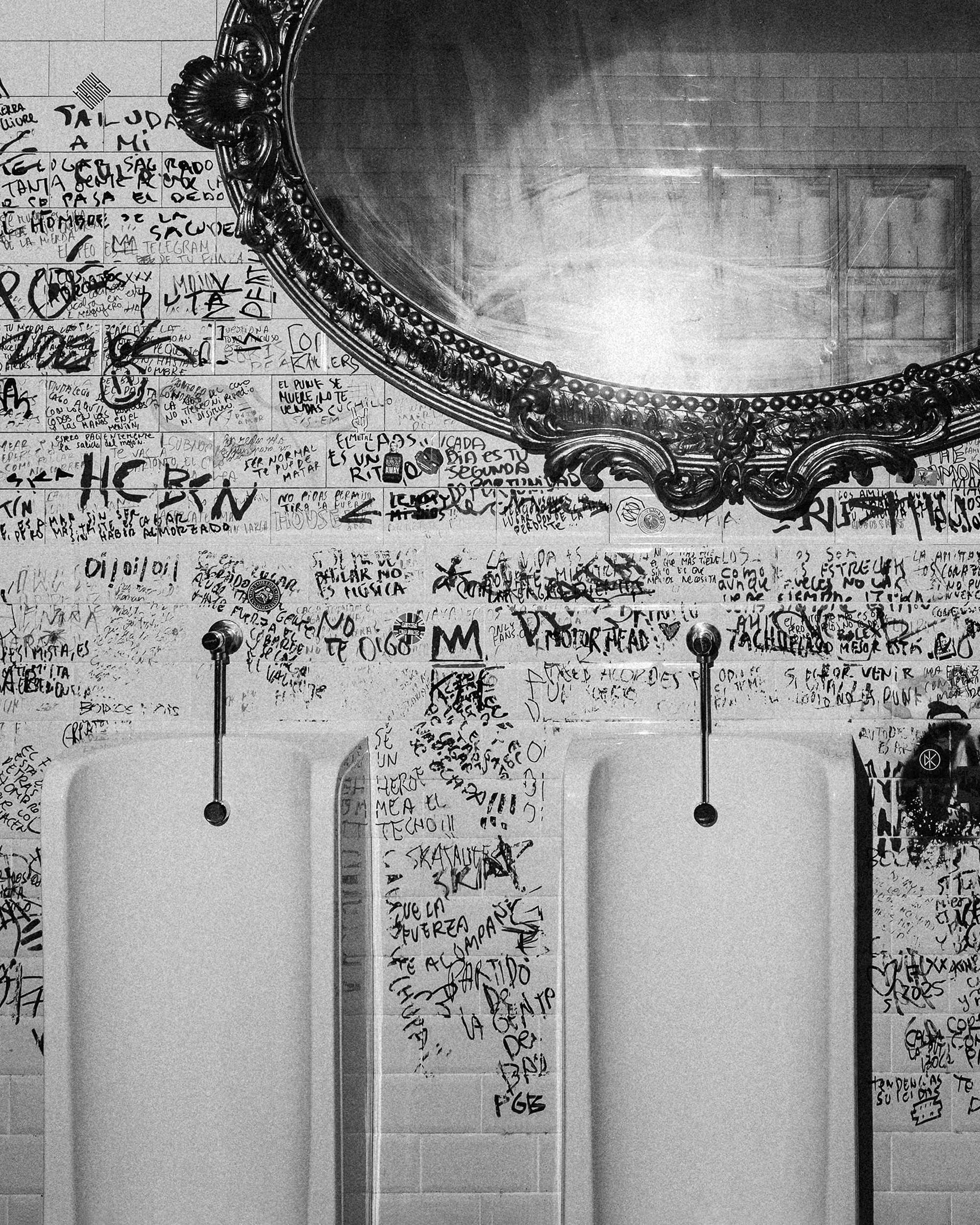 Streetside billboard with flyposters of the Batch.Works brand and illustrations