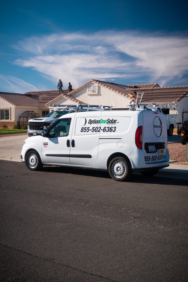 An Option One Solar service van parked at a home with rooftop solar