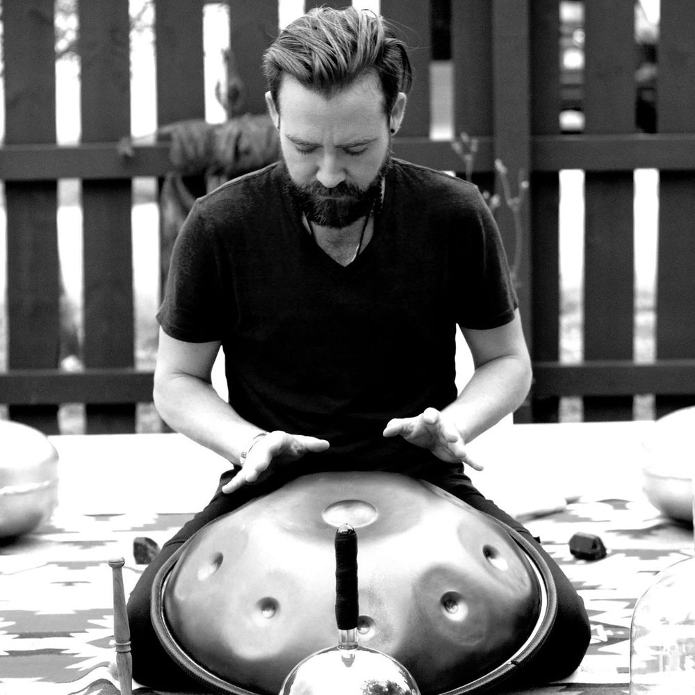 Portrait of the founder of Dream Lotus with eyes closed in daylight