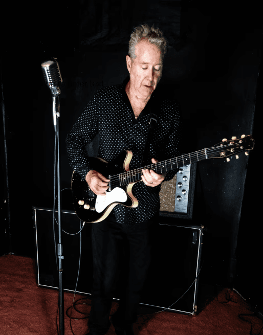 Peter Poirier playing the guitar