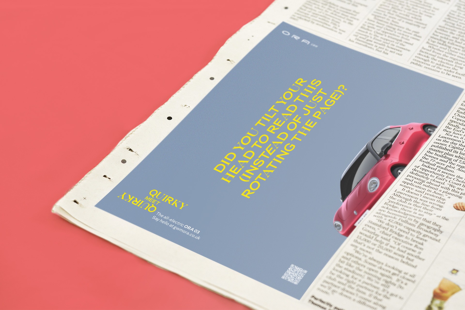 Newspaper ad for a red car, text asks "DID YOU TILT YOUR HEAD...?"