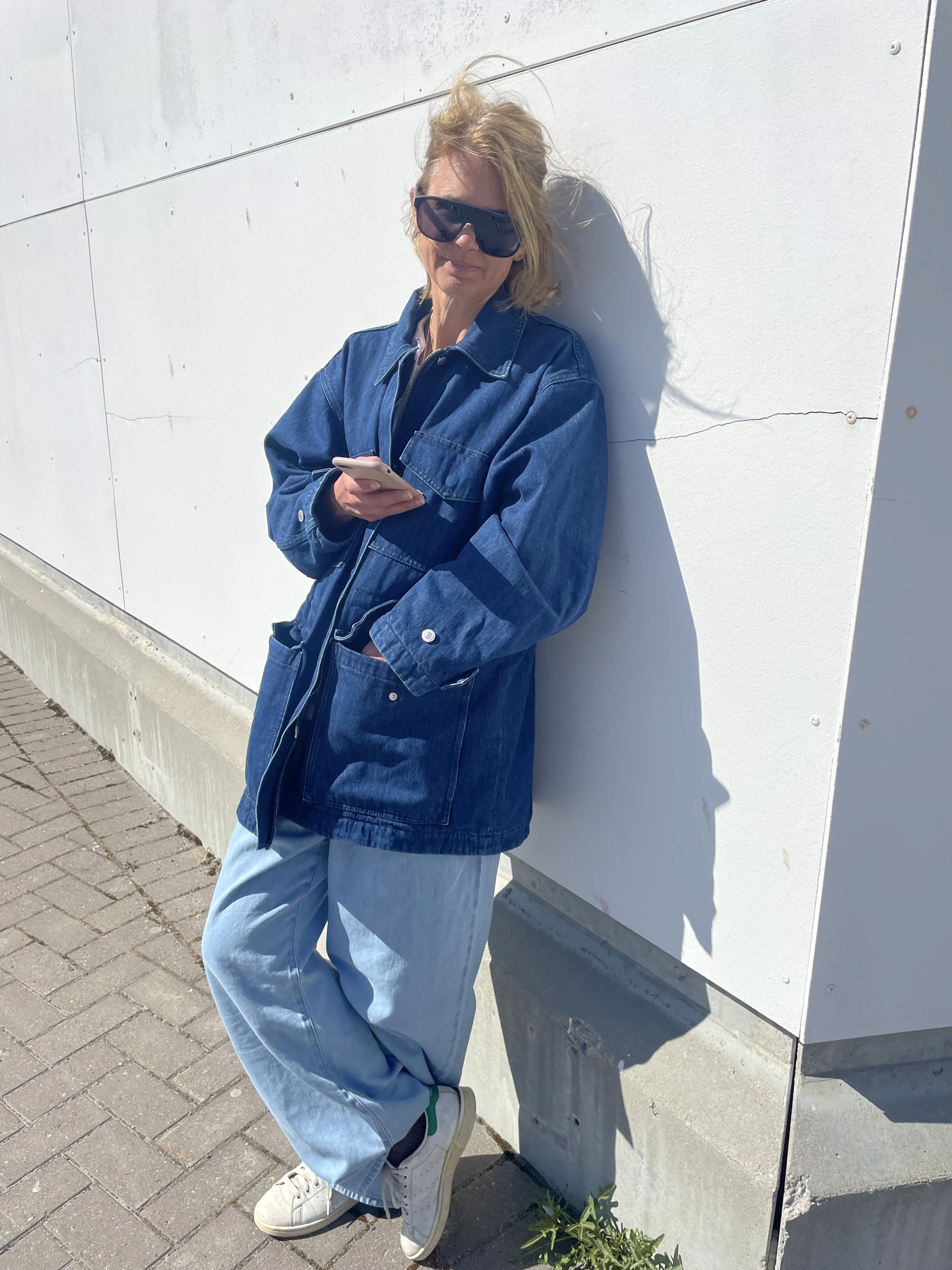 Girl standing in colorful pastel background