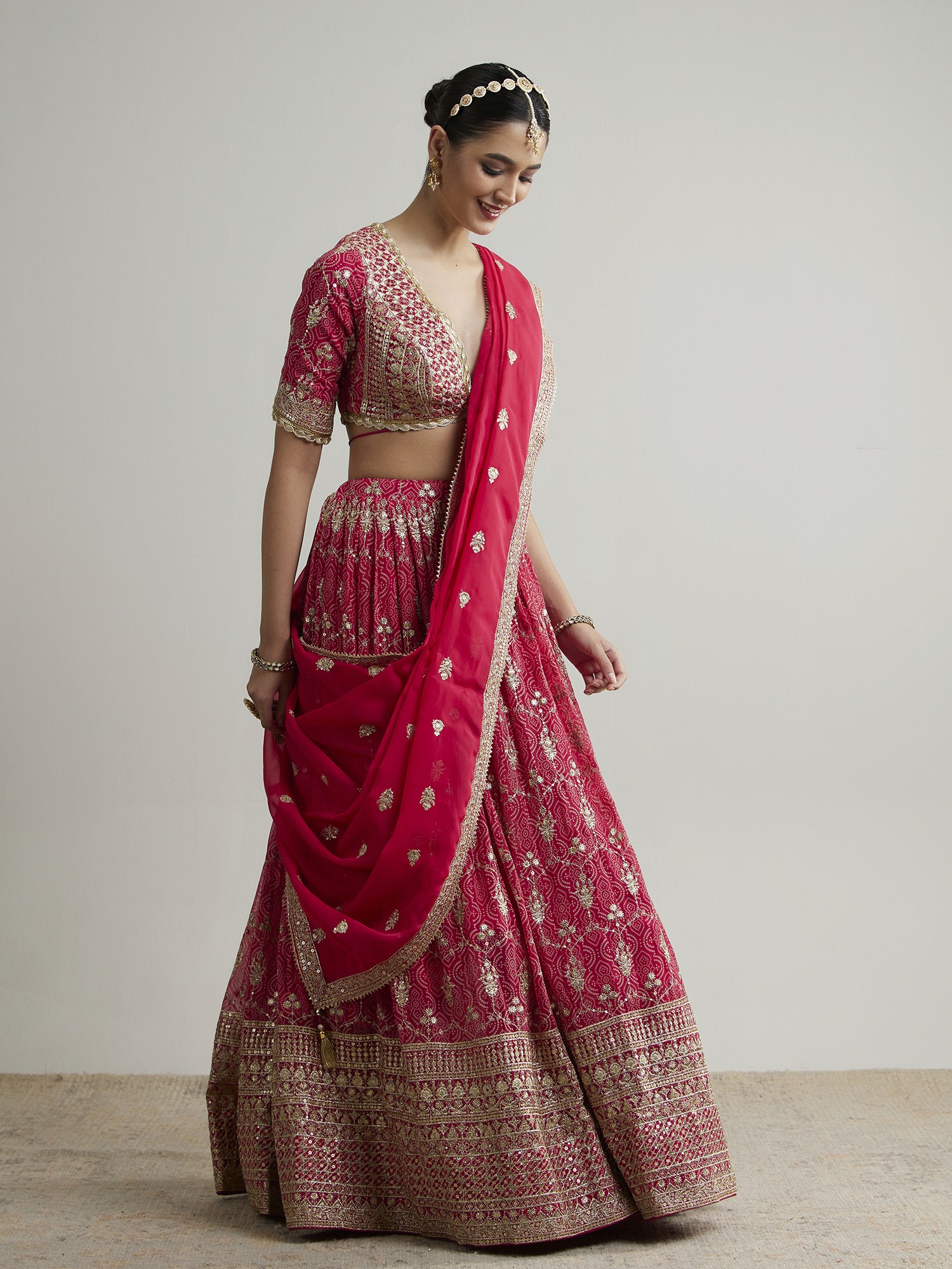 Two people talking on a rooftop at sunset
