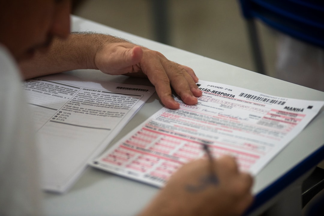 A person reviewing court forms and preparing a response - how to answer a debt summons