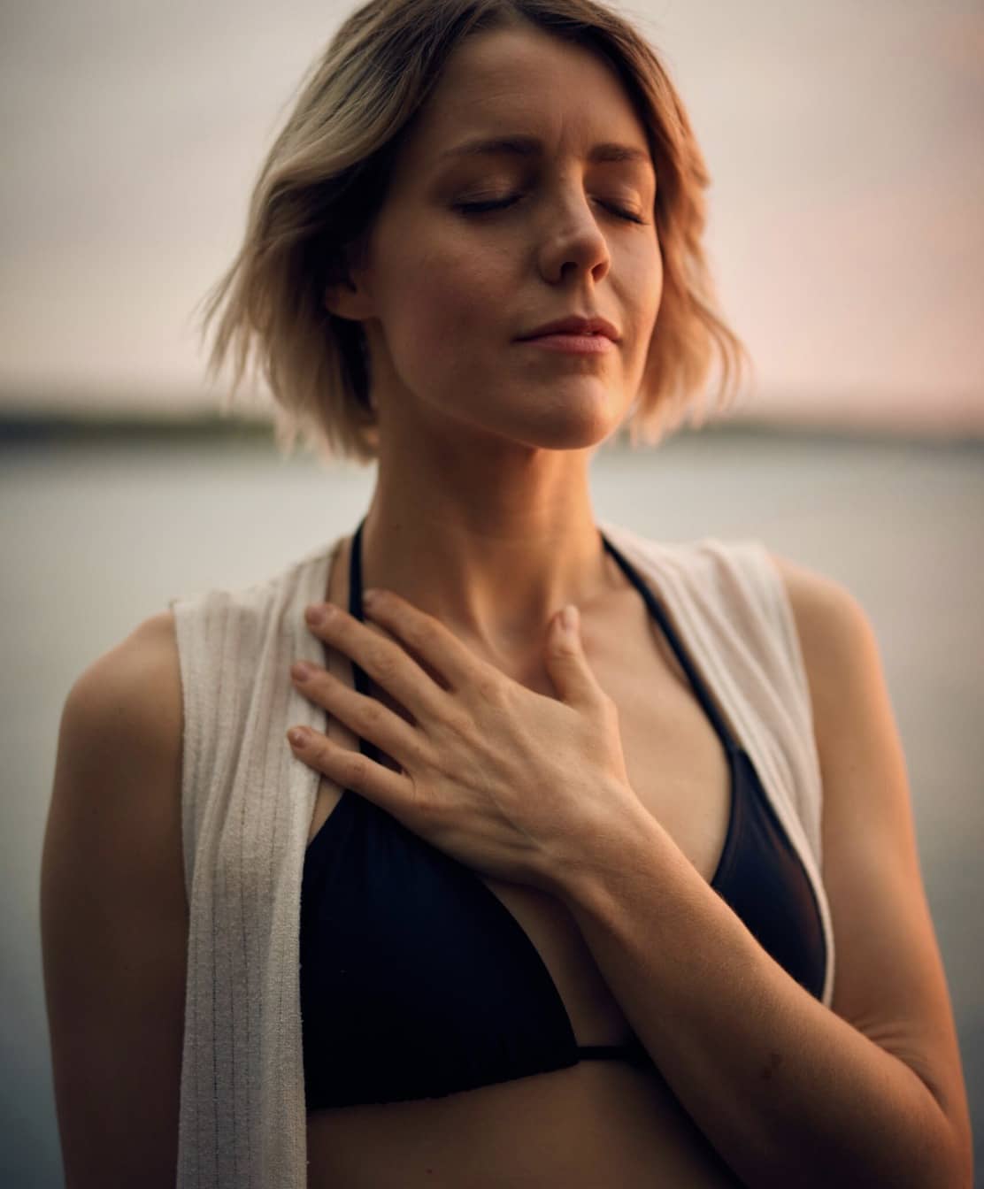 a woman at the beach looking peaceful