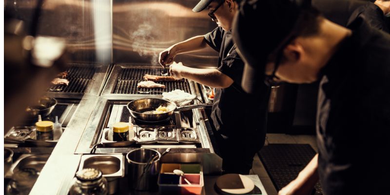 F&B staff cooking in the kitchen