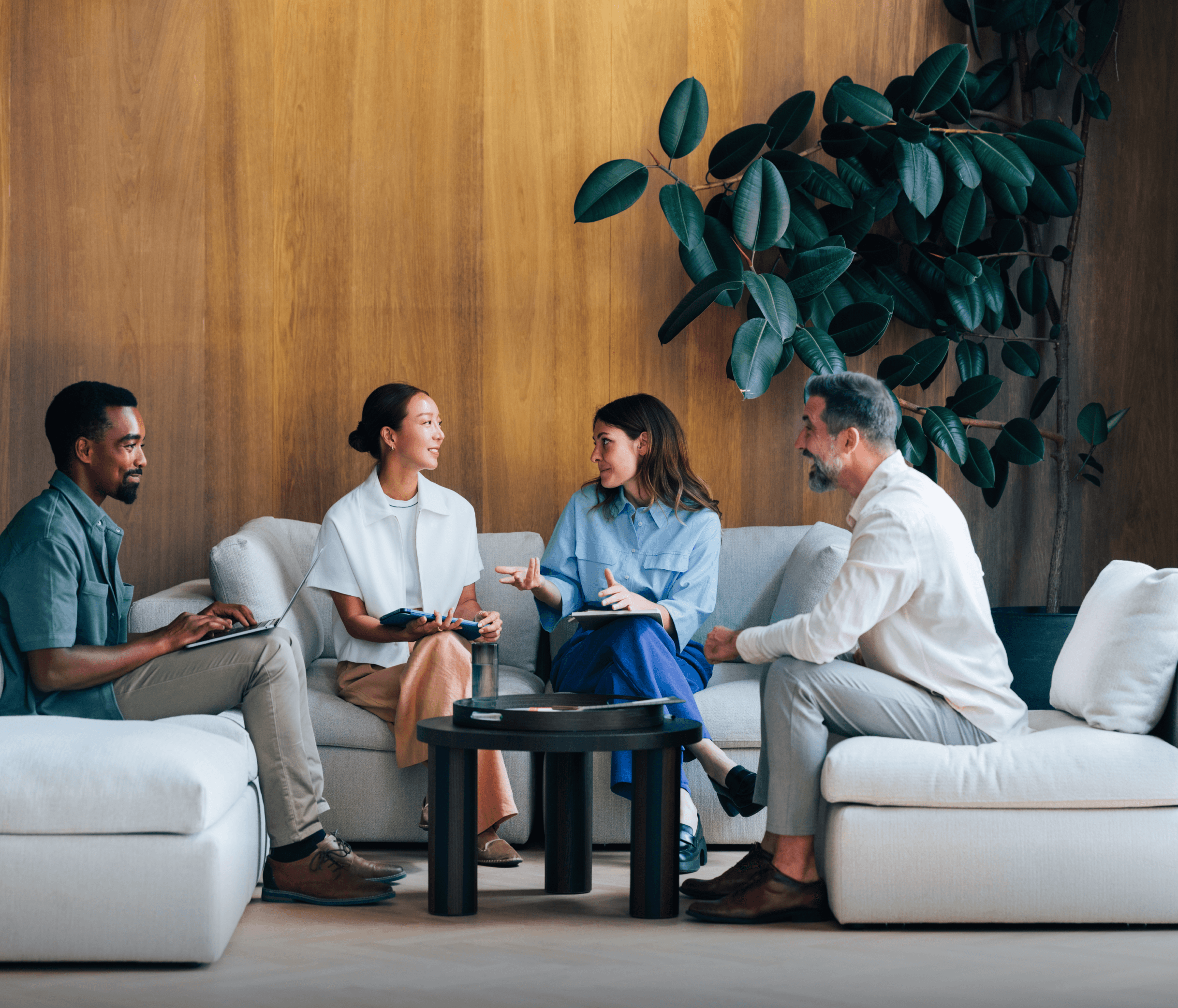 Group of people talking in the lounge area