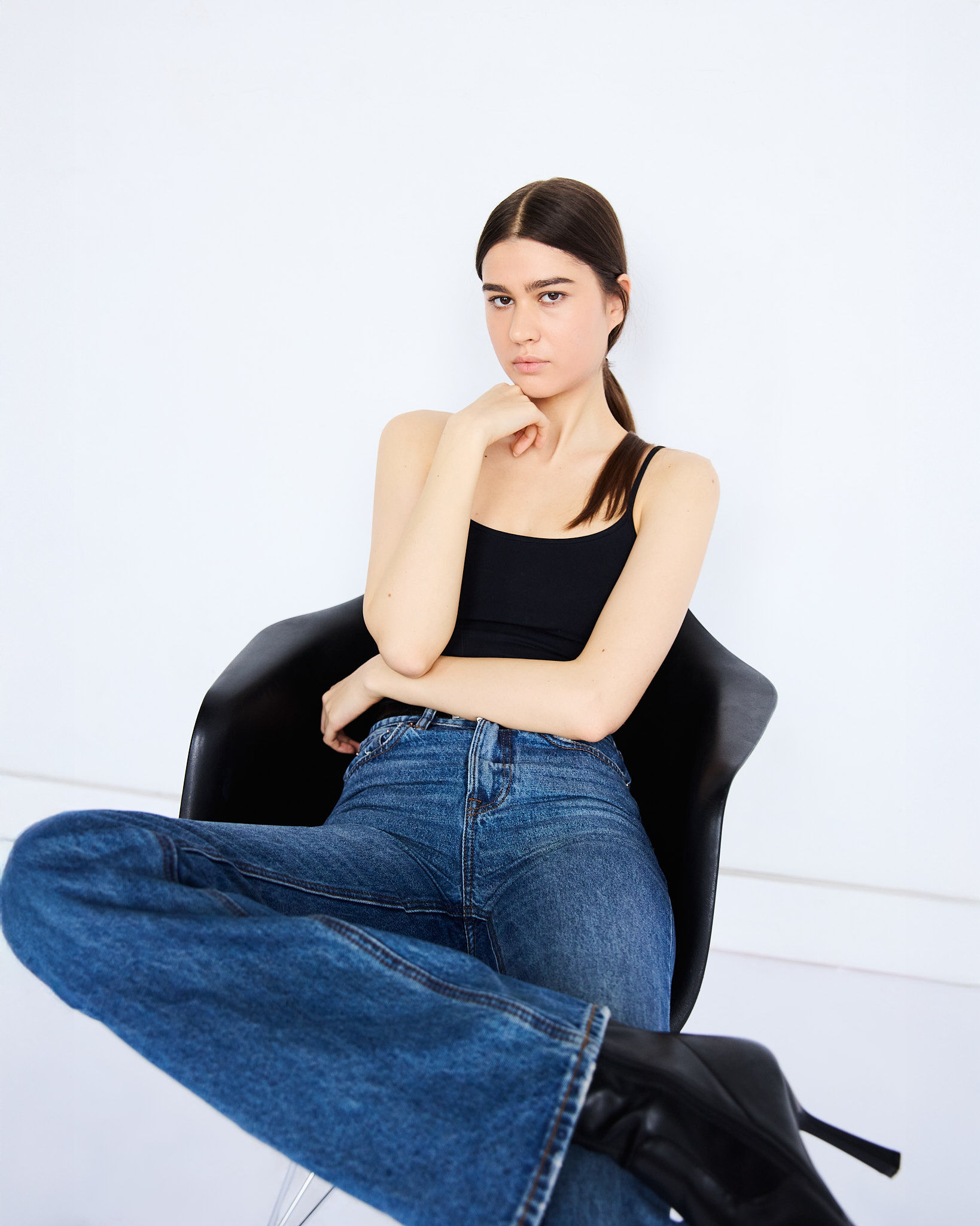 Woman walking on a curved pavement with shadow.