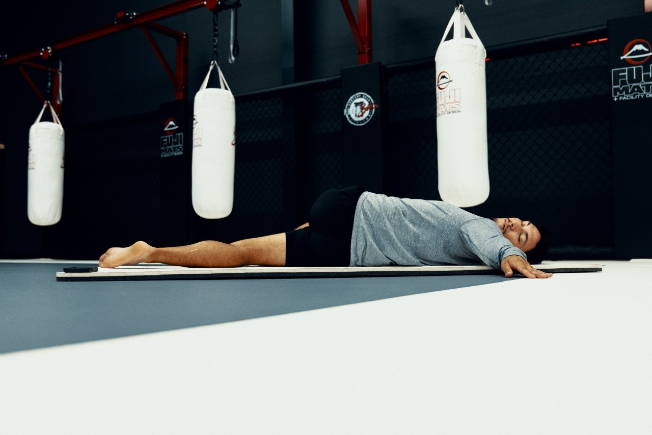 Man Stretching - Benefits of Employee Wellness Programs