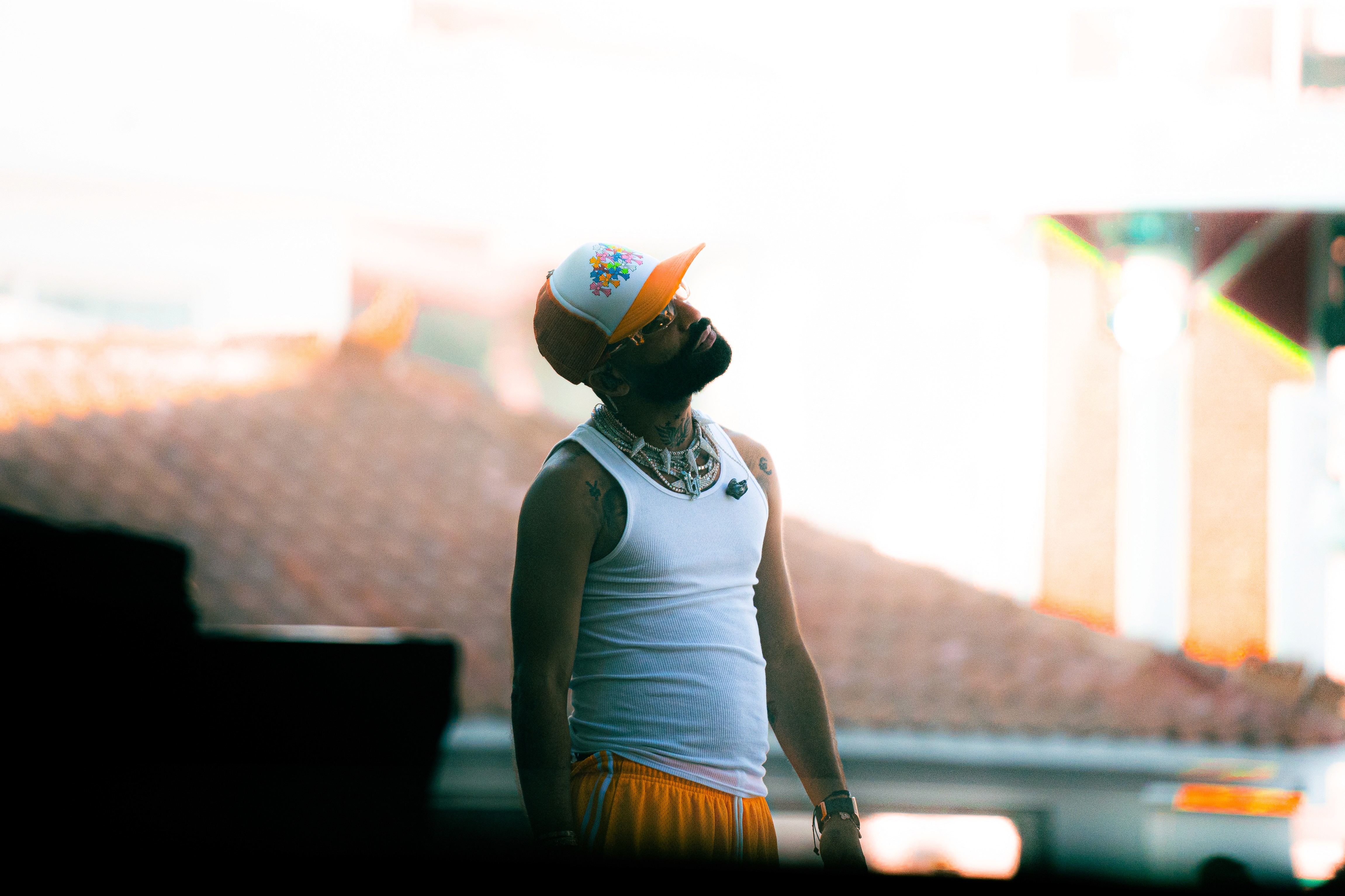  A woman with her eyes closed, wearing a helmet, appears to be in a moment of concentration or relaxation.