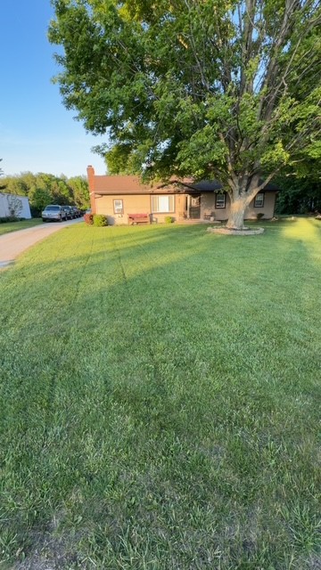 Freshly cut lawn at a completed JJ’s Outdoor Solutions job